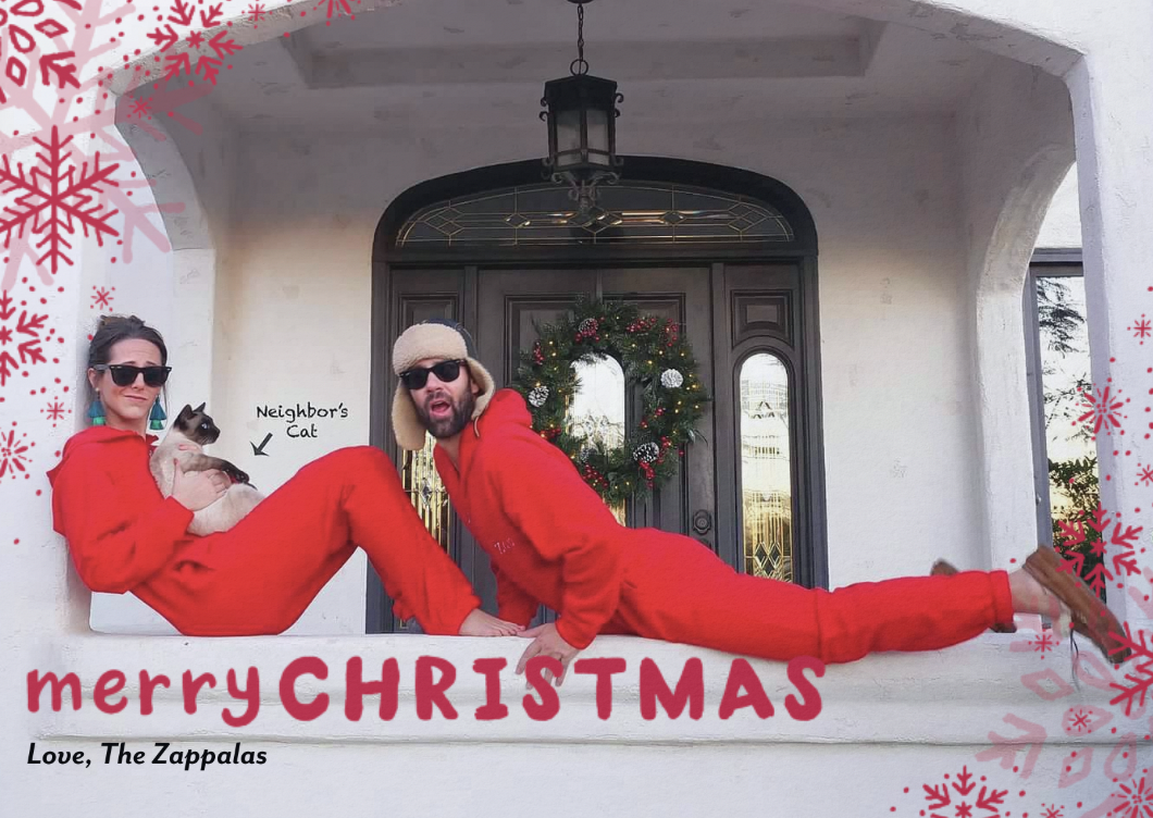Two people in red pajamas pose with a cat outside a house with a wreath on the door. Snowflake graphics and 'Merry Christmas, Love, The Zappalas' text overlay the image.