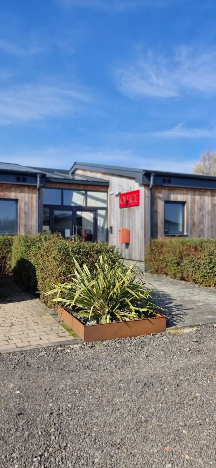 Exterior of a wooden building with a red