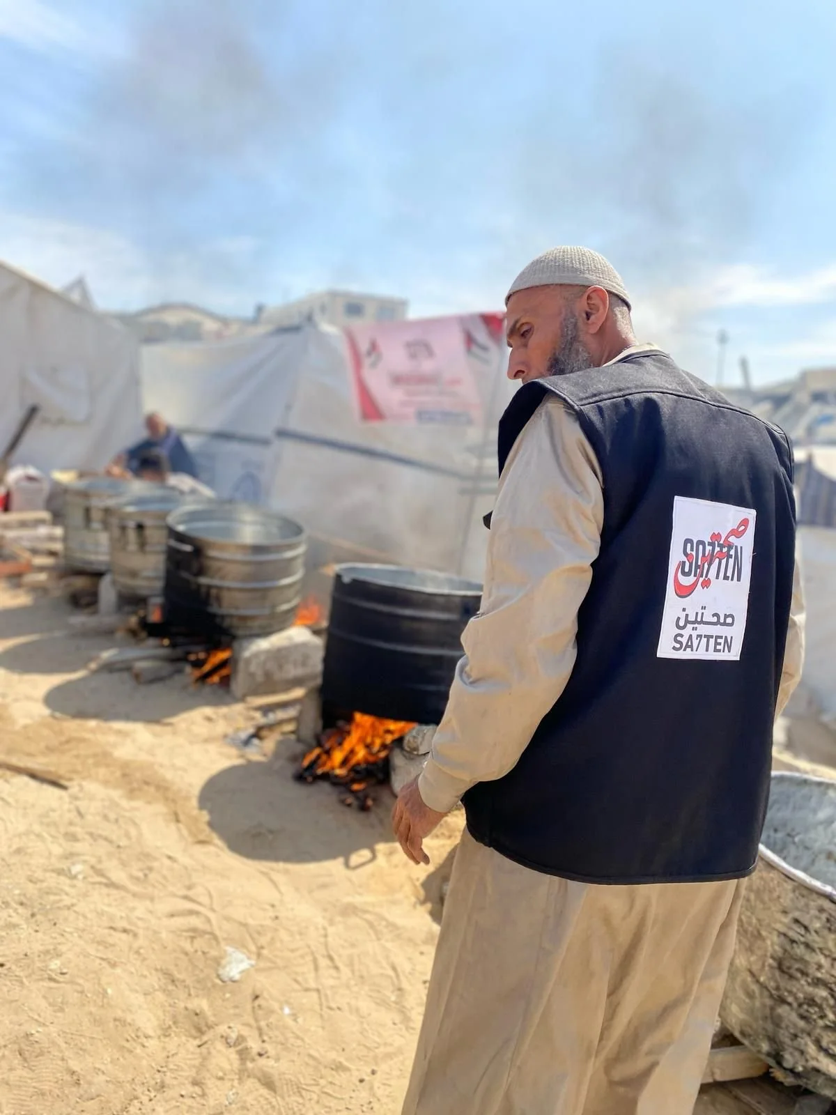 Our team leader helping our team cook in Gaza's biggest camp.