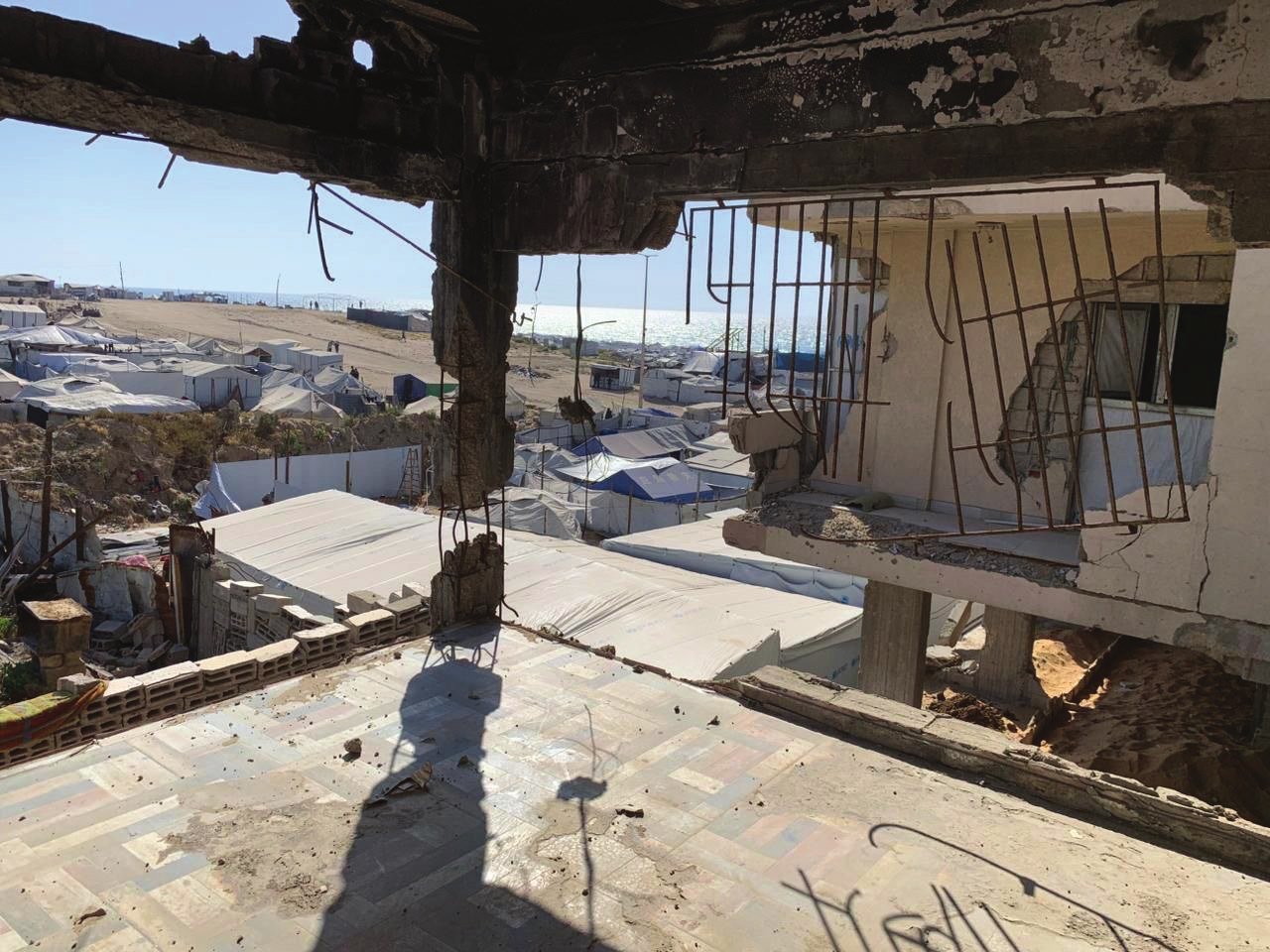 The site · Tal al-Hawa — The building overlooks a displacement camp for Palestinians forcibly expelled from their homes. A thousand of those children will come to school here.