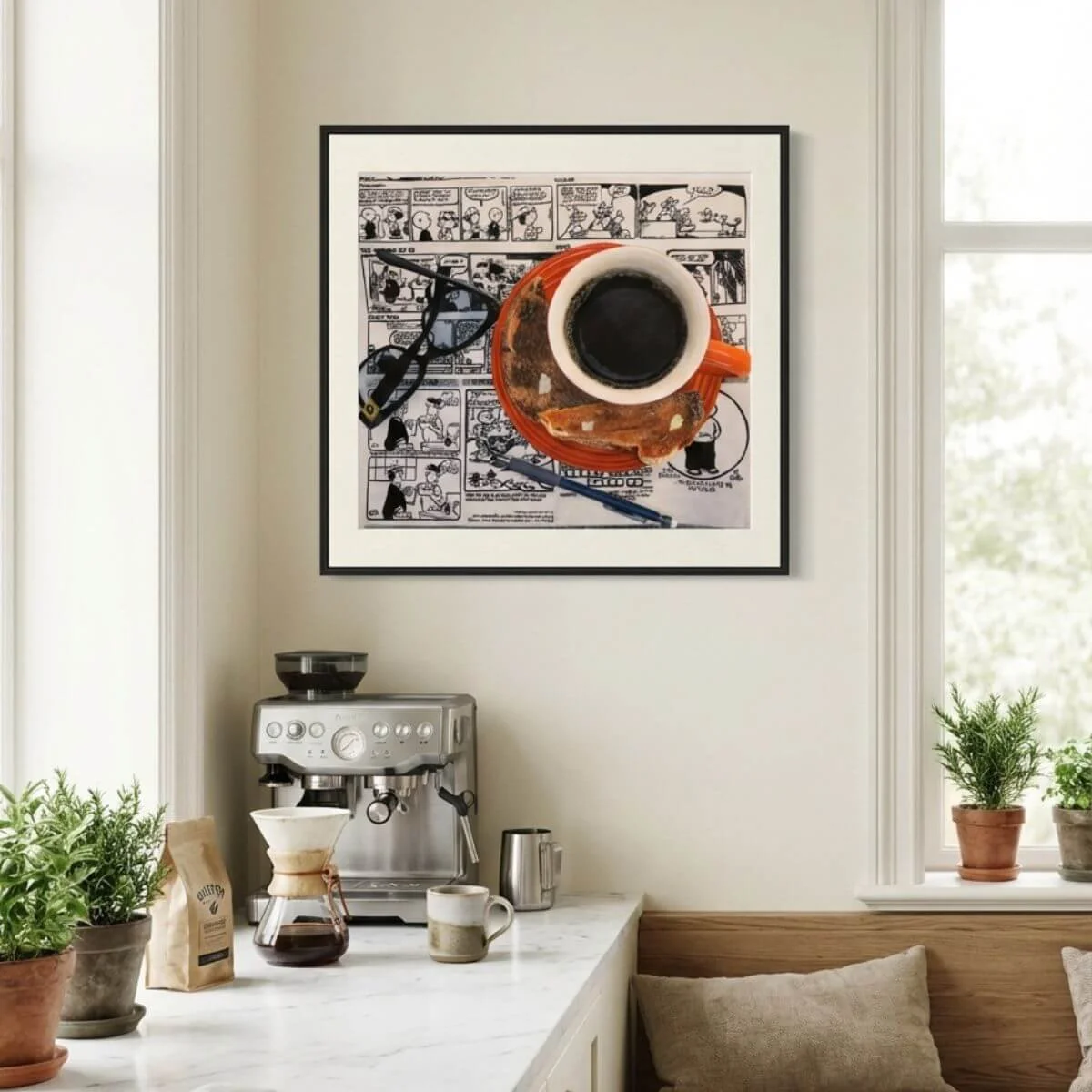 Coffee brewing setup on a wooden counter with a potted fern, a mug, and a coffee makers, near a window with a view outside, and a framed painting of a coffee cup on the wall.