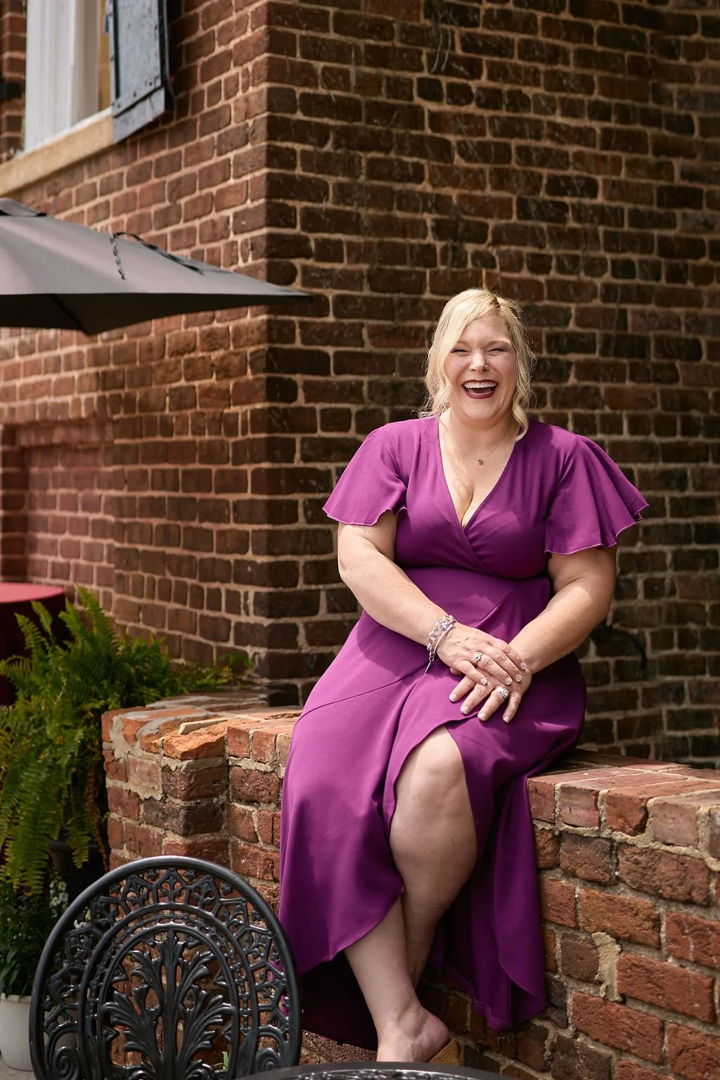 erika-sitting-outside-laughing.jpg