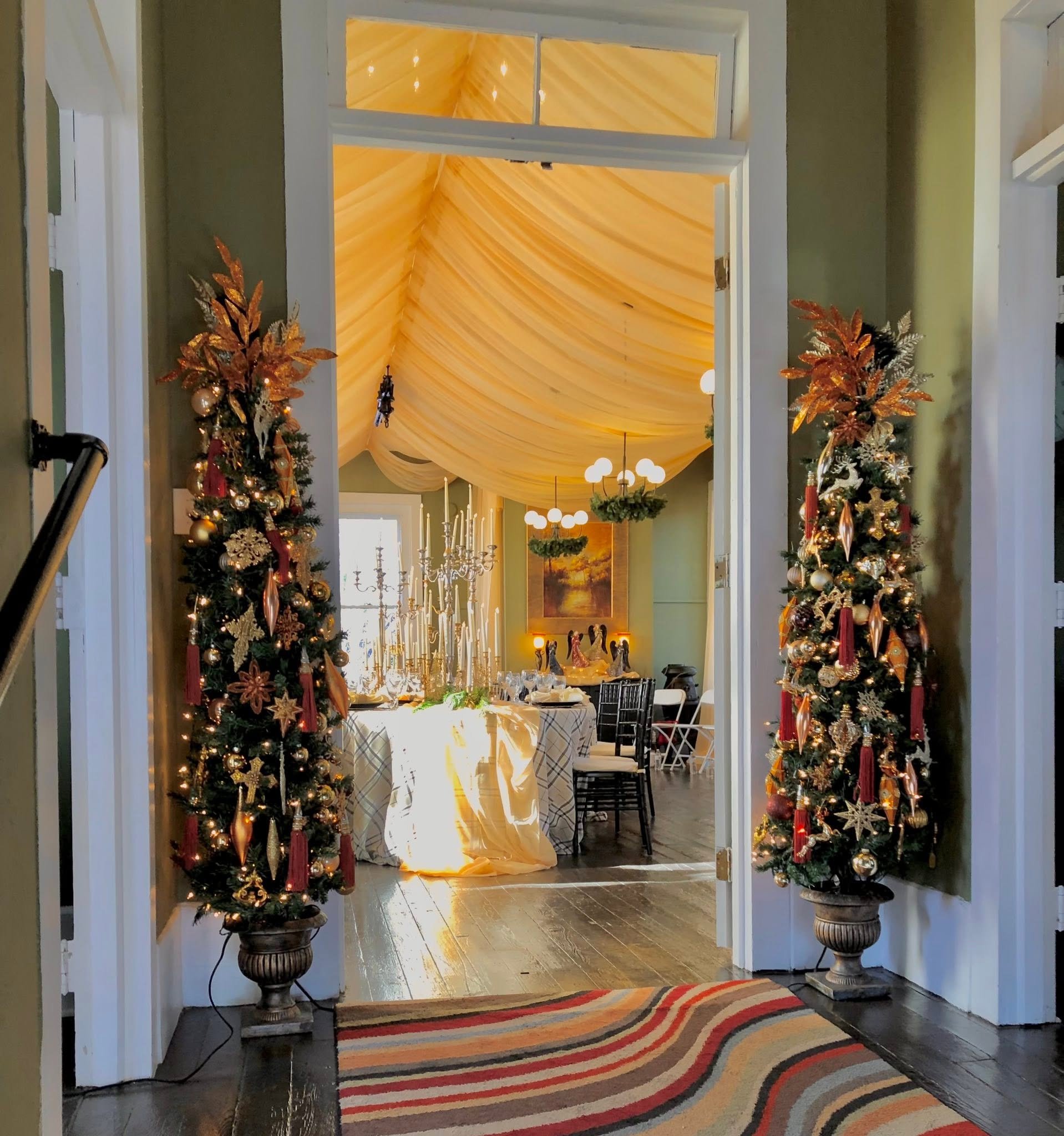 Christmas trees beside doorway