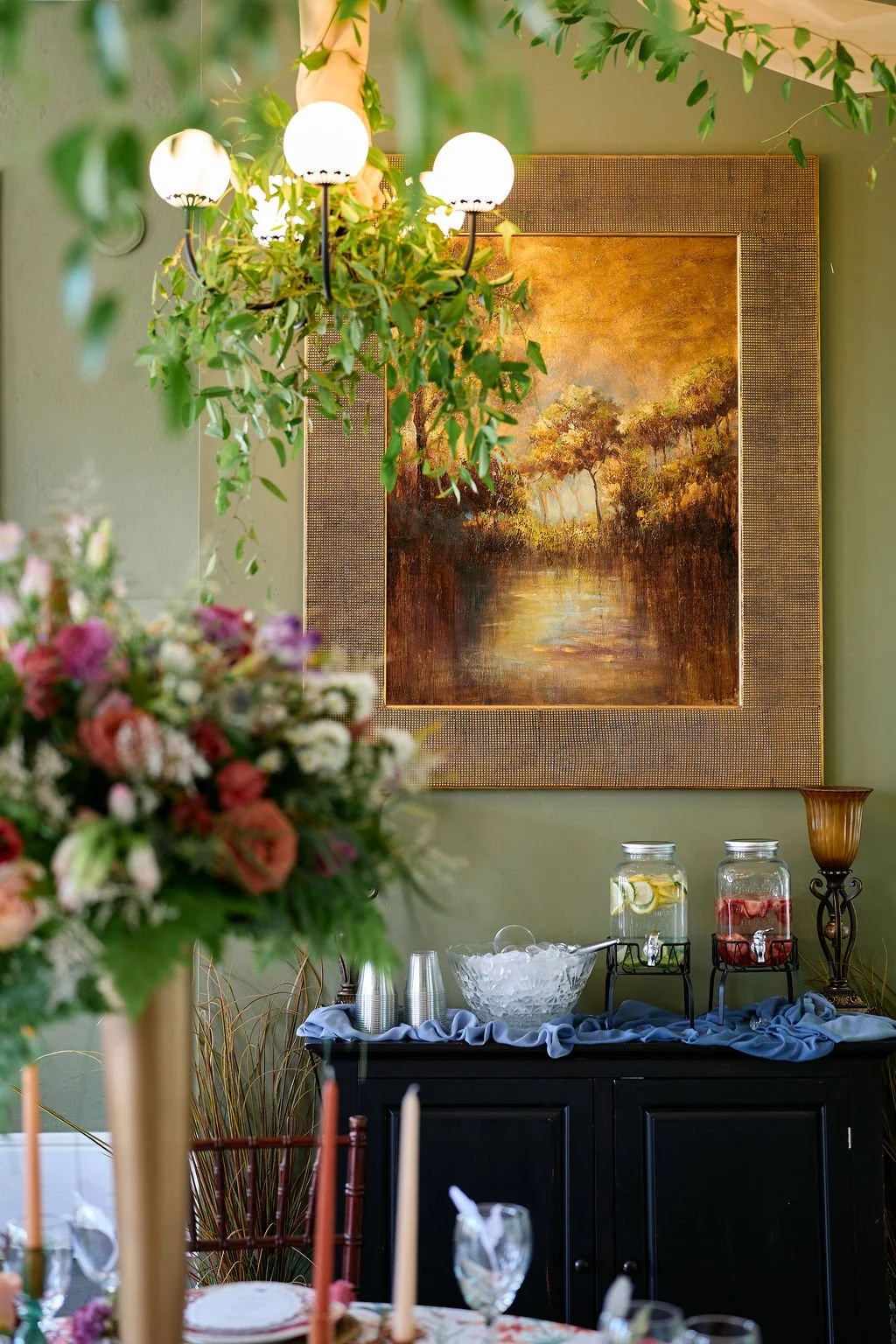 drink table with flowers and greenery decor