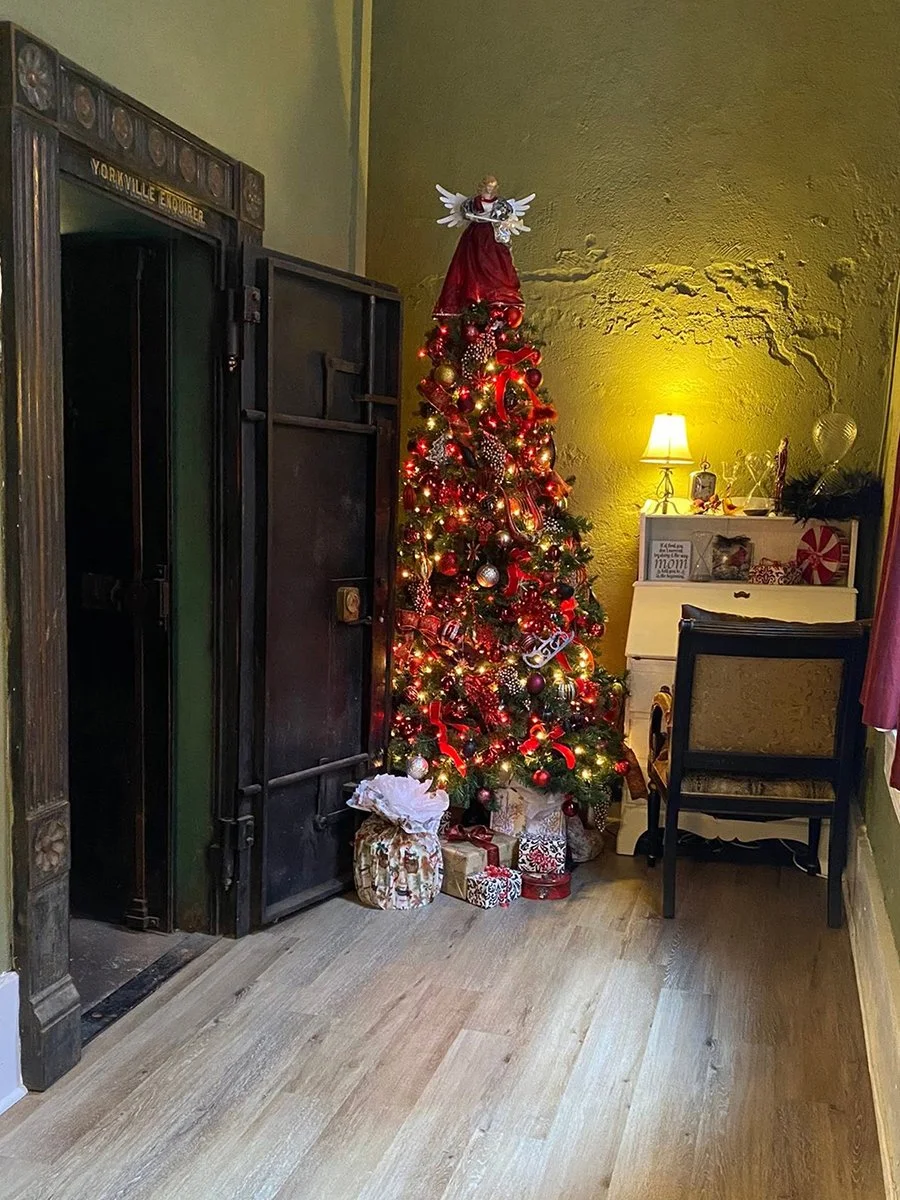 Yorkville Enquirer vault with Christmas tree decorated in red