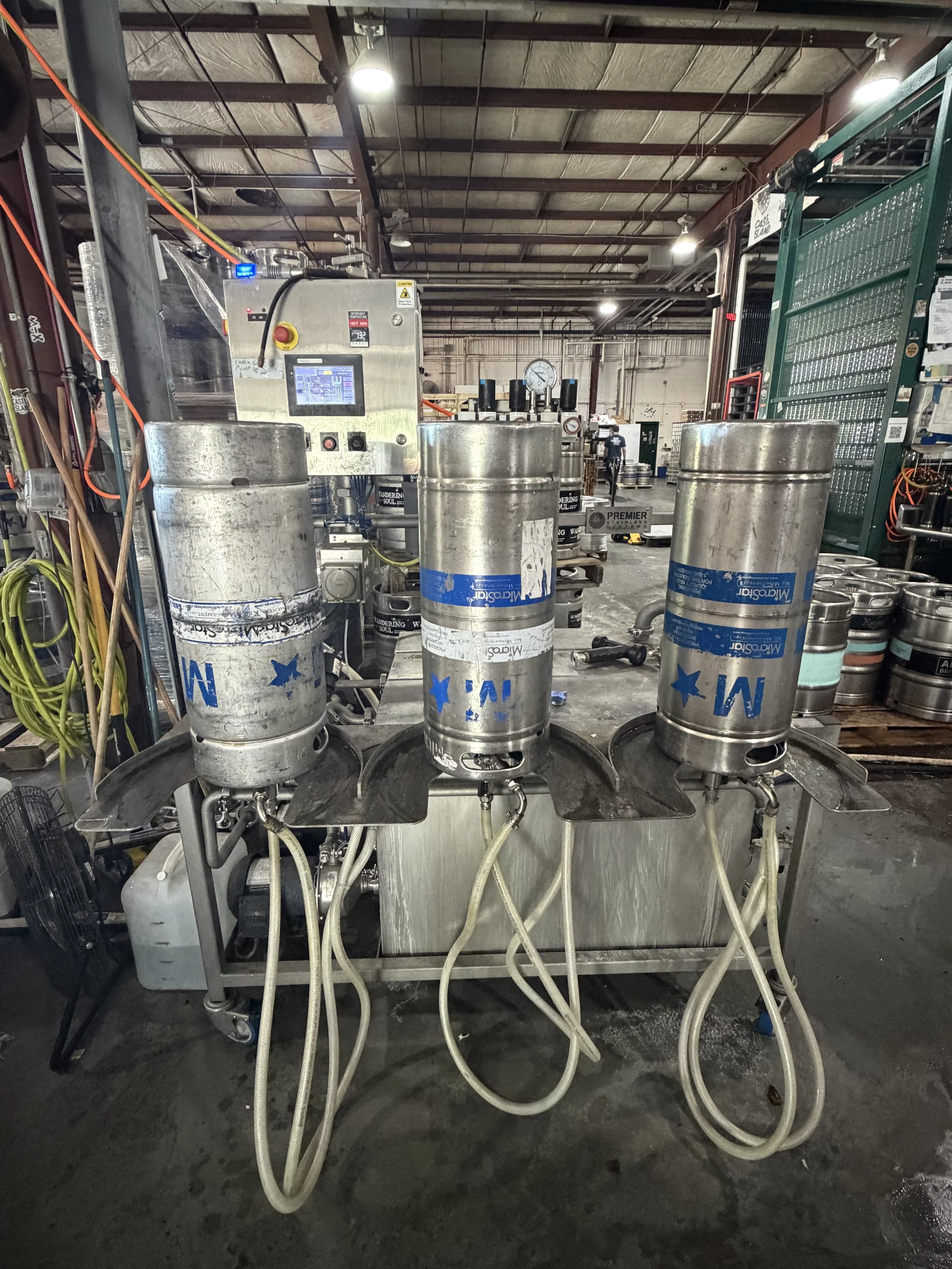 Keg Washers located in Castle Island Brewing warehouse. A beer keg washer is a specialized device or automated machine used to clean, sanitize, and purge beer kegs to prevent contamination, off-flavors, and spoilage.