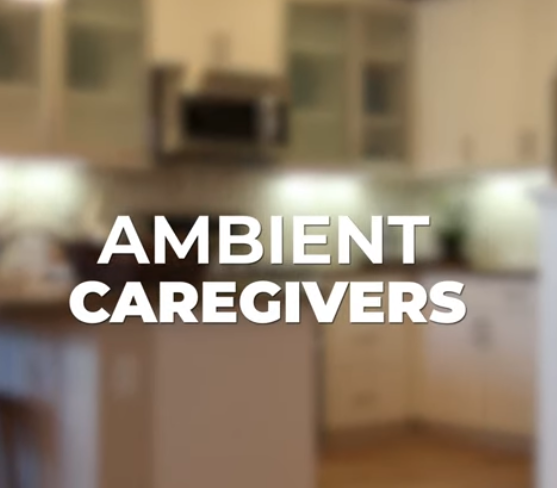 Blurry kitchen background with the text 'Ambient Caregivers' in bold white letters.