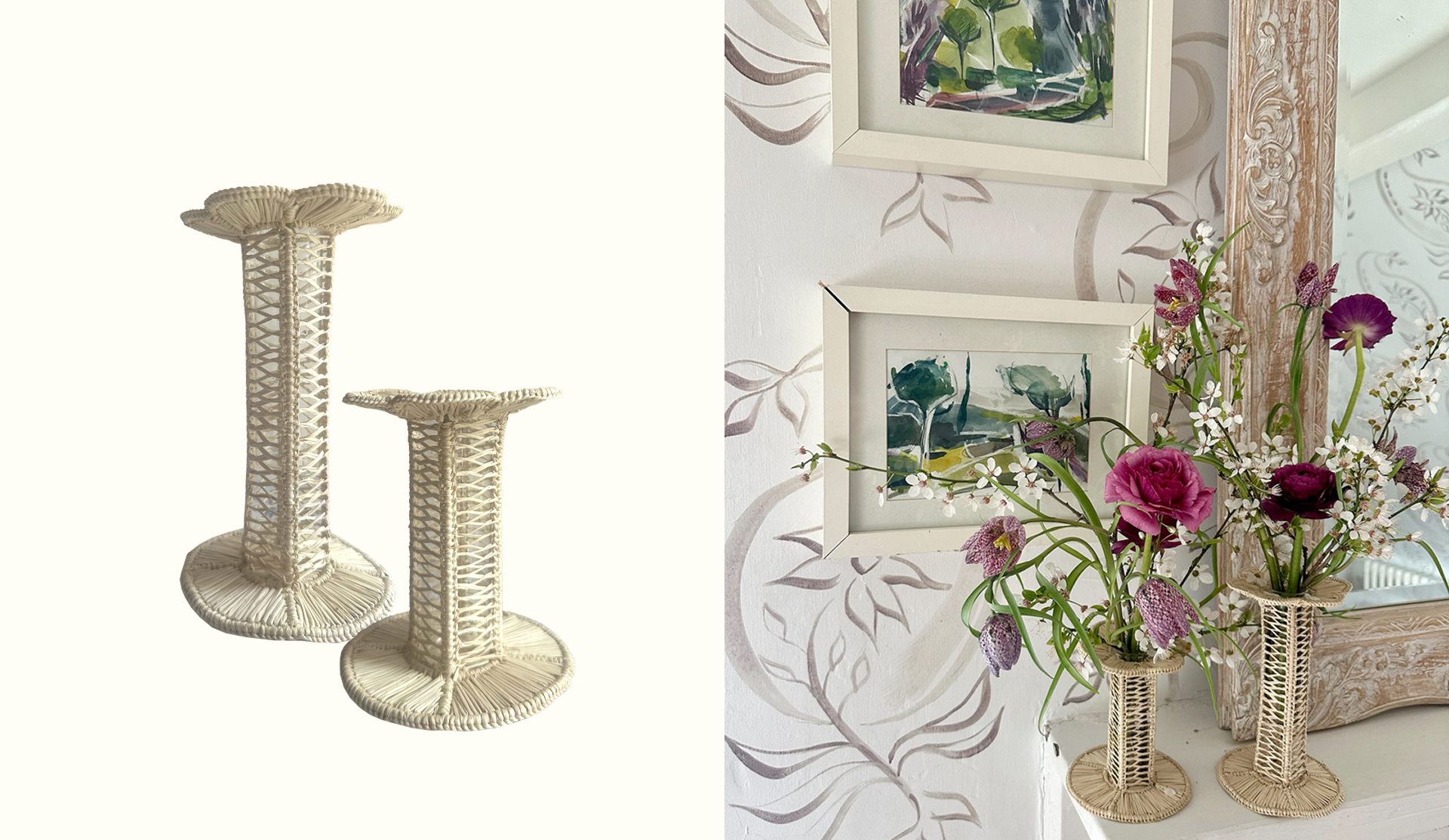 Pair of woven wicker candle holders or plant stands with round bases and openwork cylindrical bodies, one taller than the other, placed on a white surface in a room with floral wallpaper, framed watercolor paintings, and a mirror.