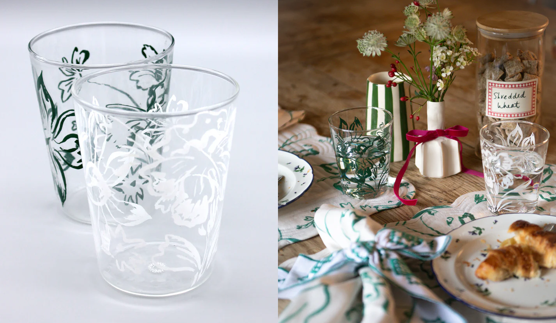 Two clear drinking glasses with white floral etched designs, one behind the other, on the left. On the right, a table setting with a white cloth napkin with green trim, a plate with croissants, a small glass with the same etched floral design as the