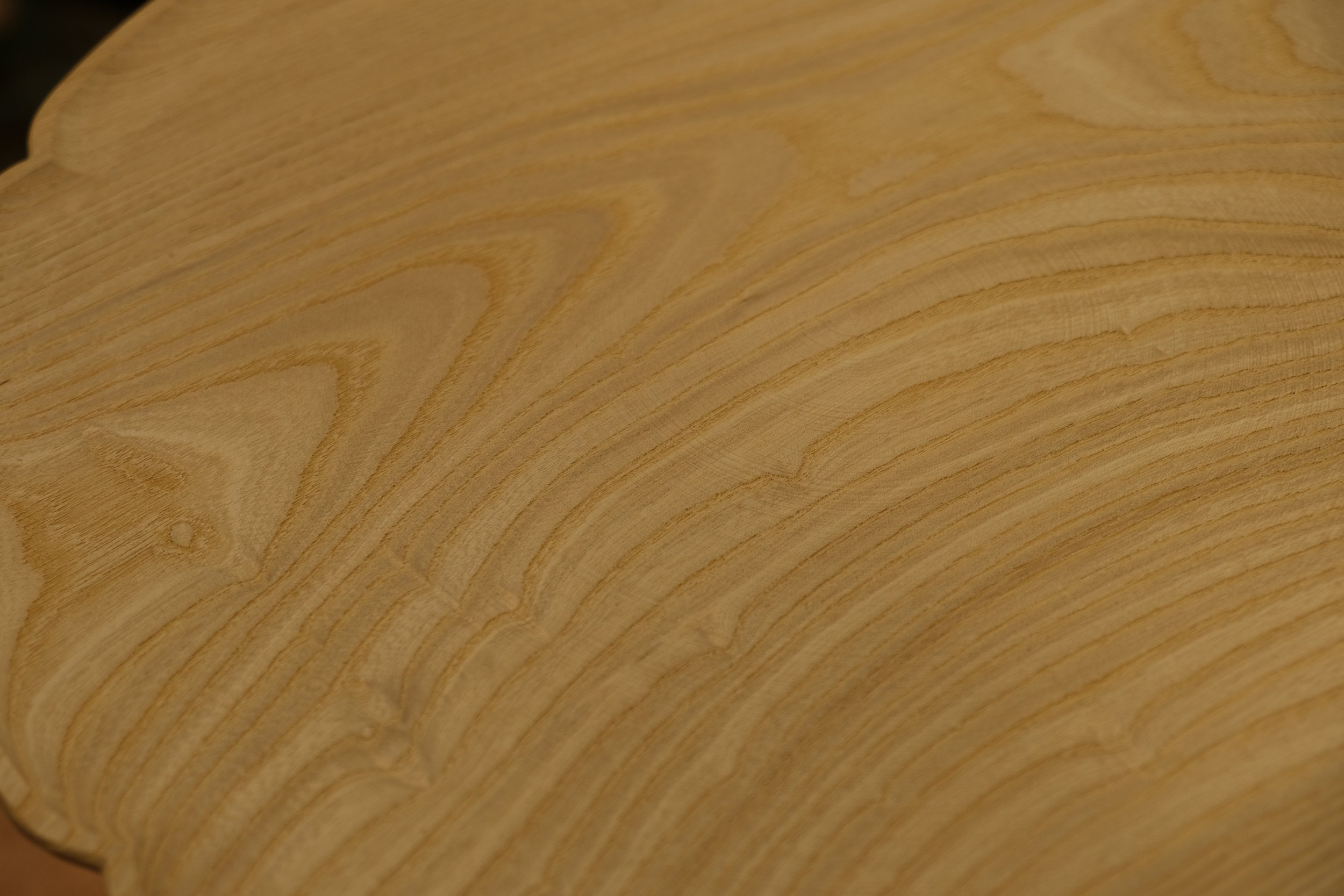 Close-up of a wooden surface showing natural grain and texture.