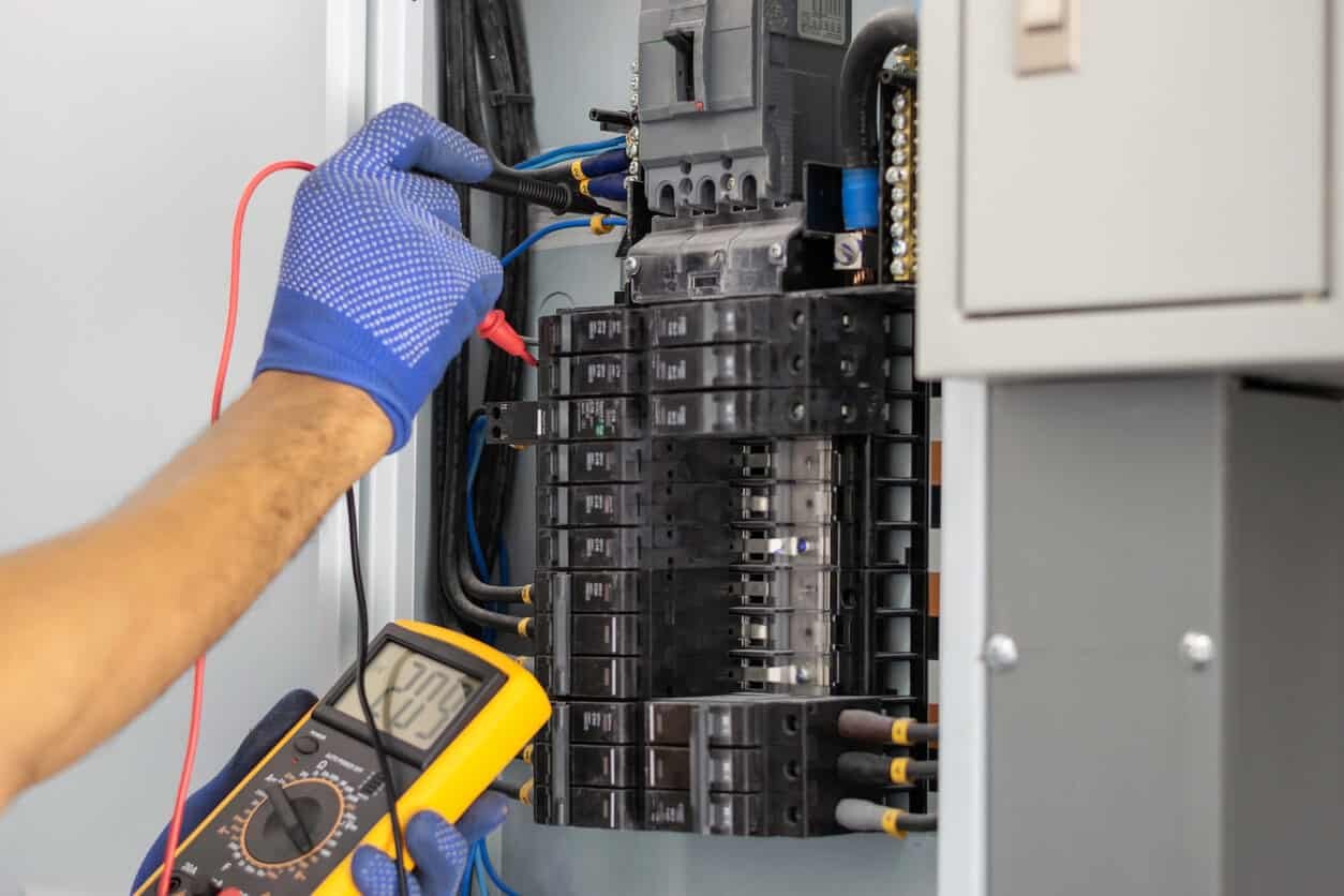 electrician-inspecting-circuit-breaker-panel.jpg