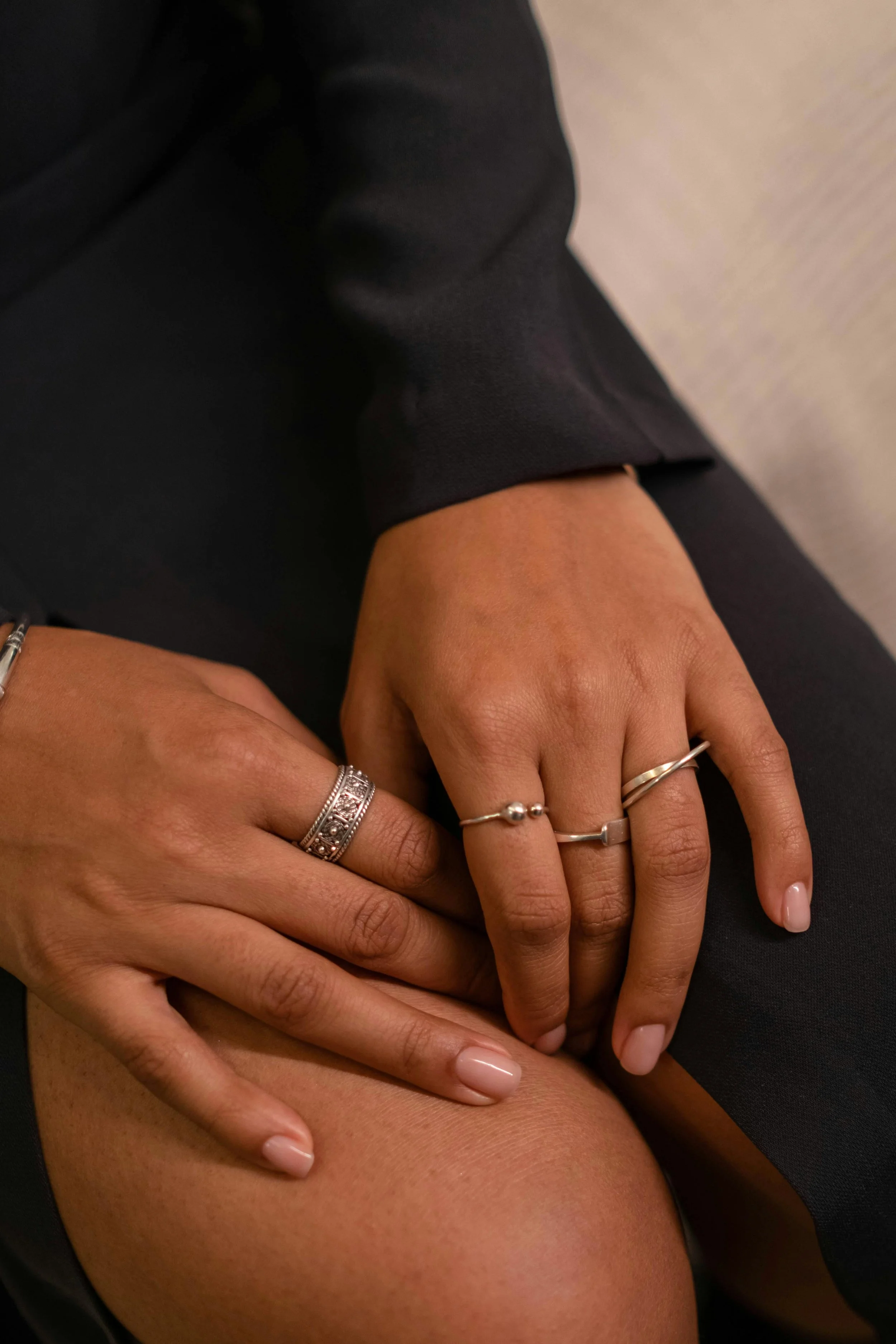 sleek silver jewellery with a modern black outfit
