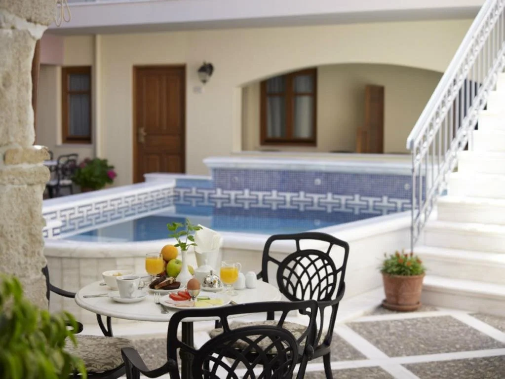 • Outdoor swimming pool  • 20 Rooms with En-suite bathrooms  • Bar  •  Kitchen • Junior Suites  • Maisonettes • Suites •  Superior •  Double Rooms •  Private Parking