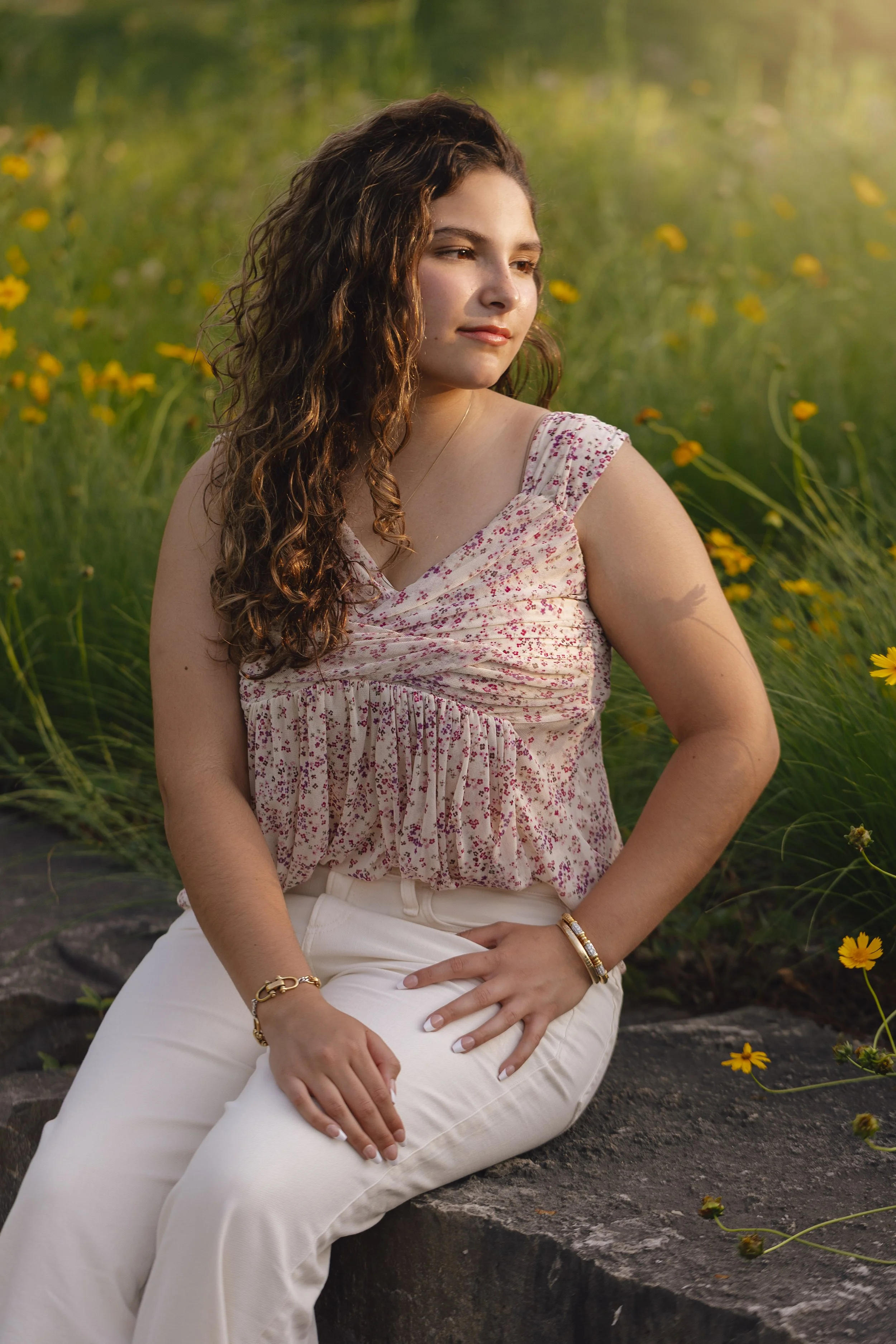 Heirloom true to color high school senior portrait in Las Vegas flower field with natural light