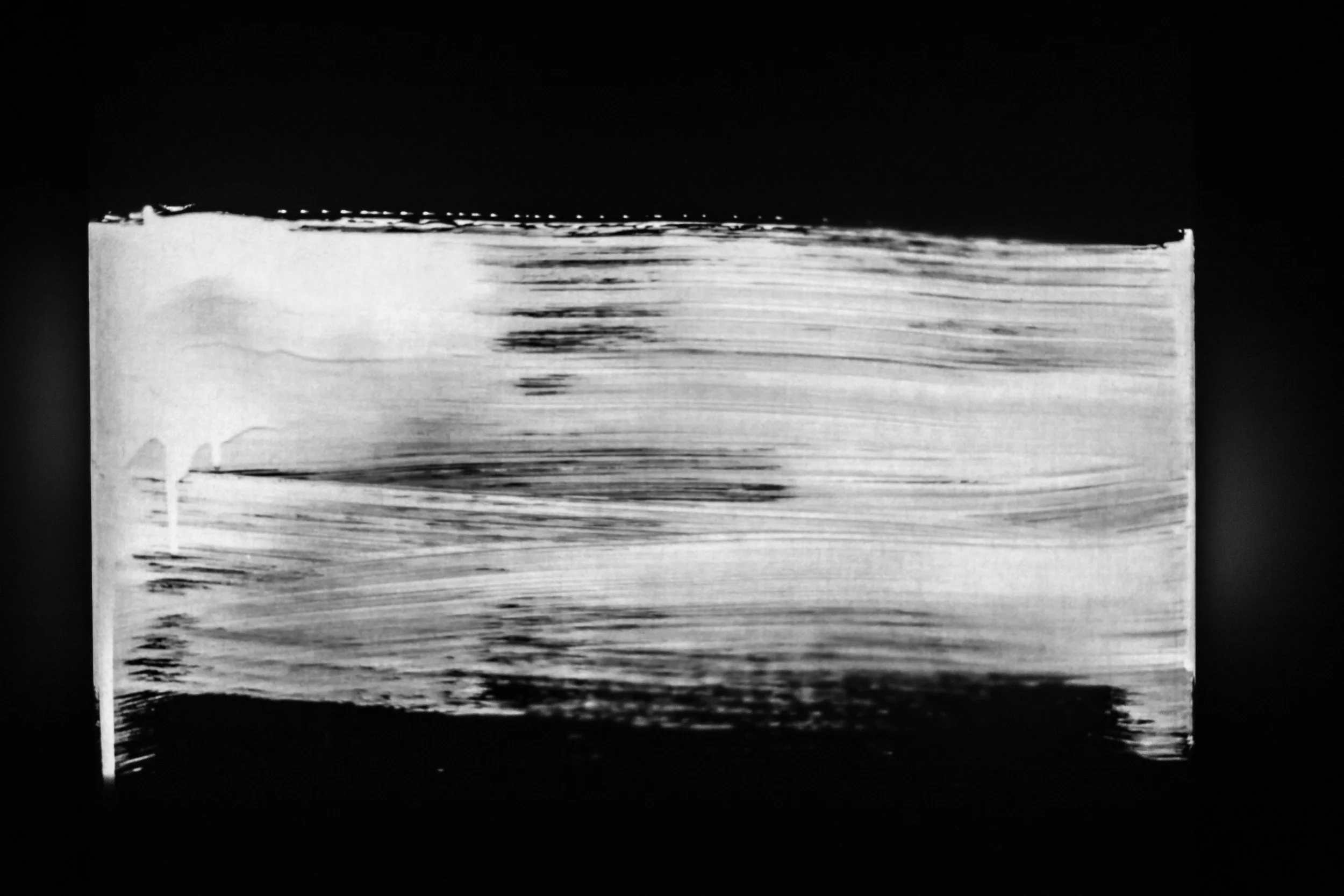 Black and white abstract painting with horizontal streaks and smudges on a rectangular canvas.