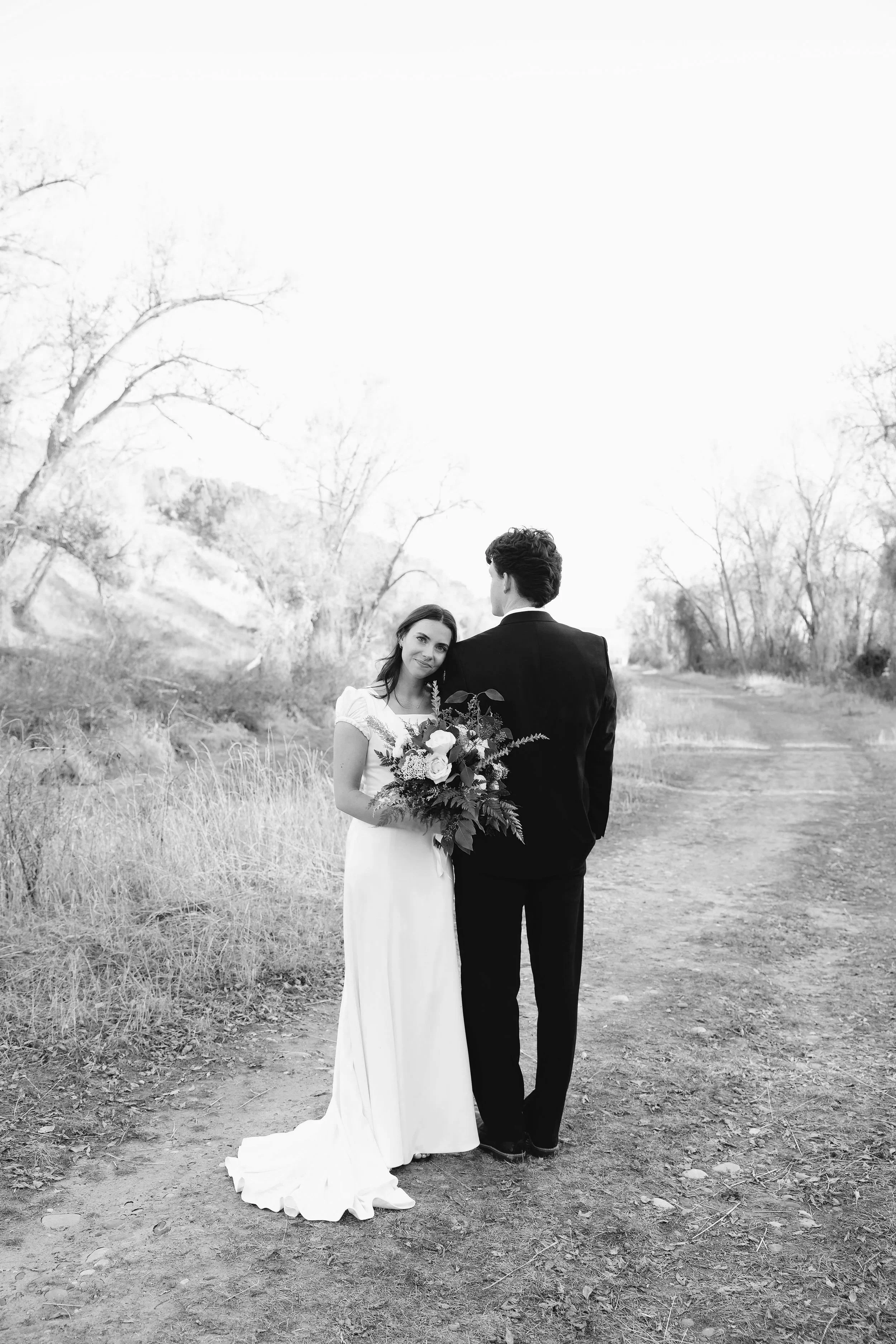 A white chair casting a shadow on a light gray background