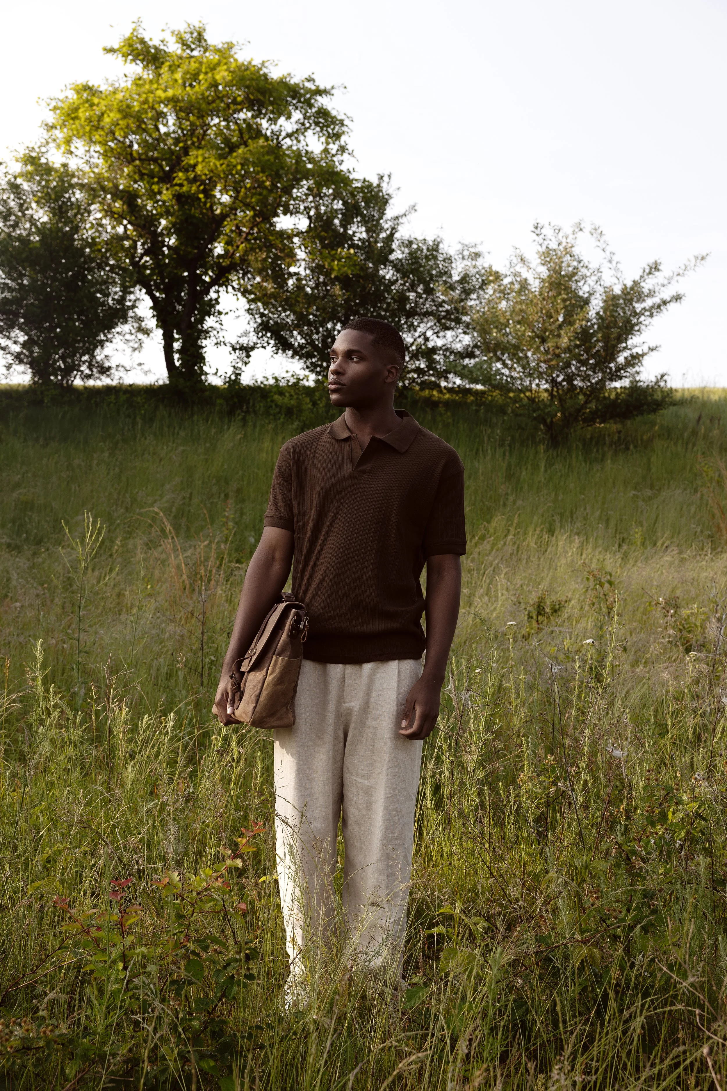 Heirloom film style solo portrait in Henderson with natural light in a grassy field