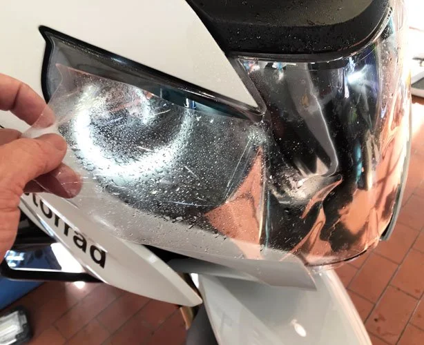 A BMW motorcycle getting clear bra applied.