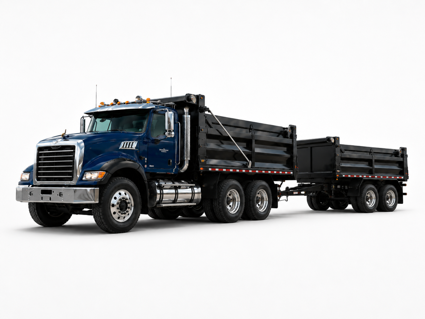 Blue dump truck and pup trailer for hauling.