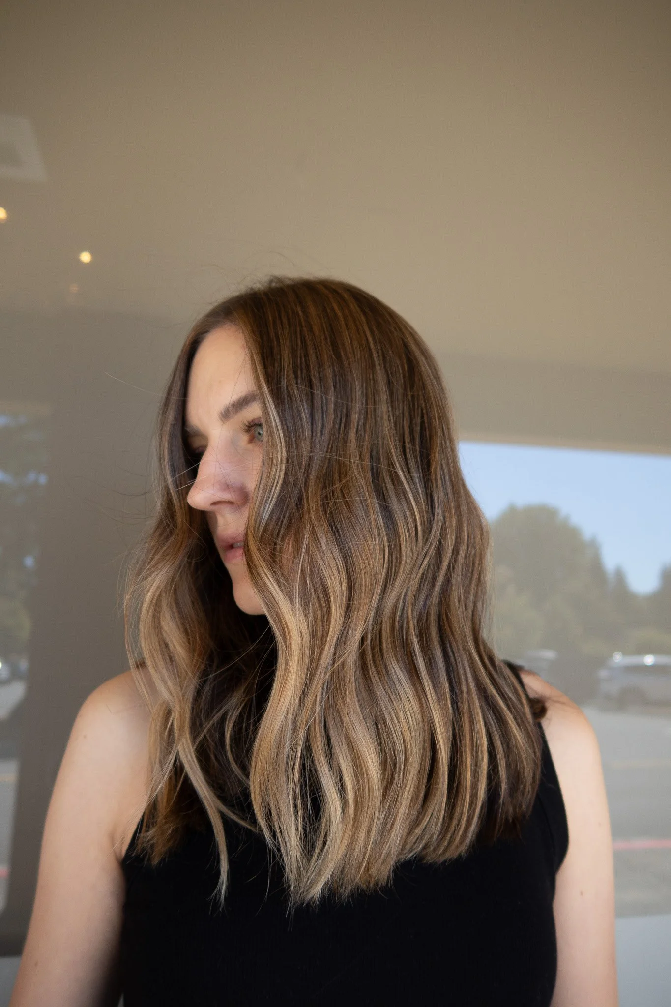 Rich Brunette and bronde balayage with soft dimension, blended highlights, and effortless waves by 
Salon Janae in Bothell, Washington.