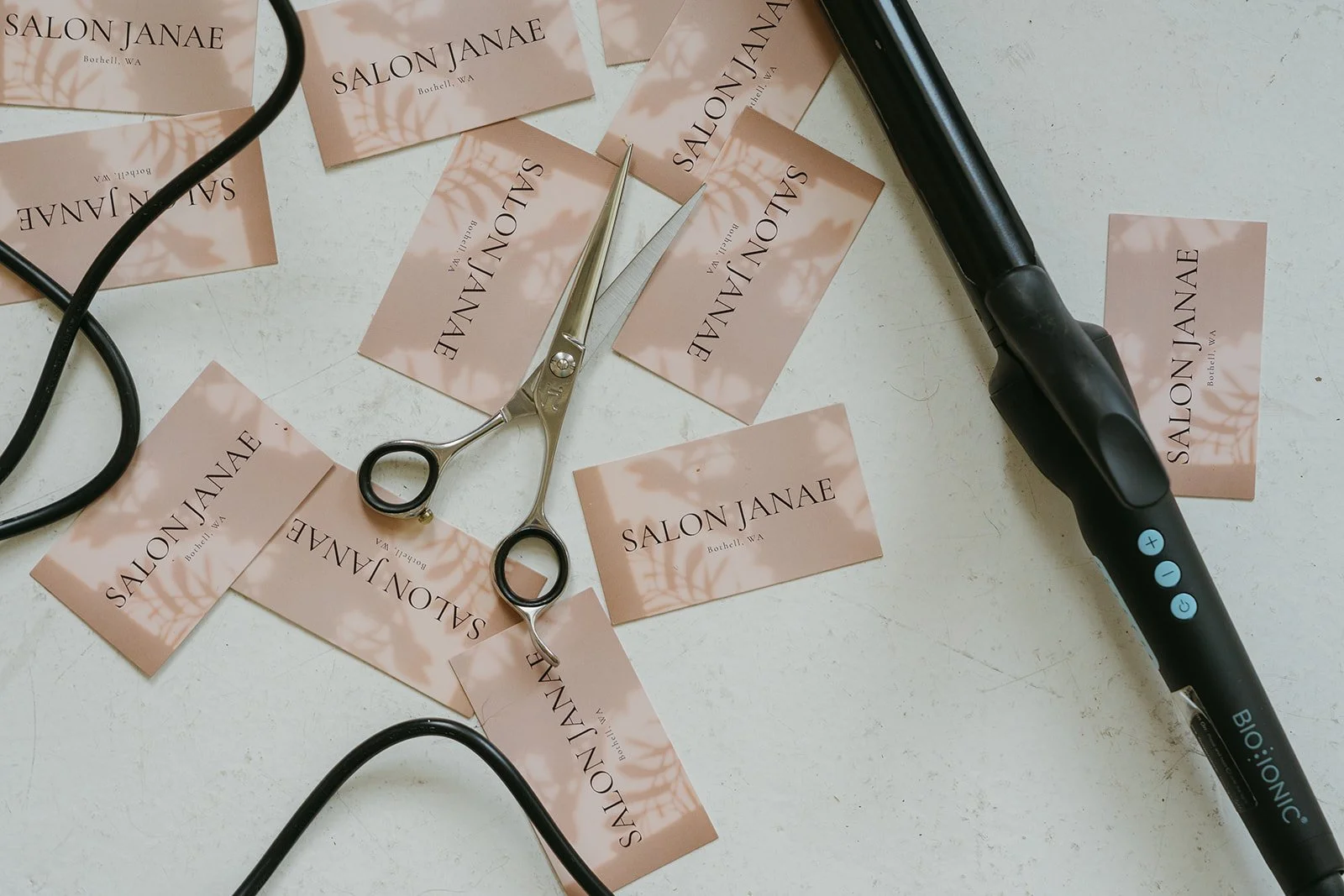 Salon Janae branding materials, professional haircutting shears, and hairstylist tools in Bothell, Washington