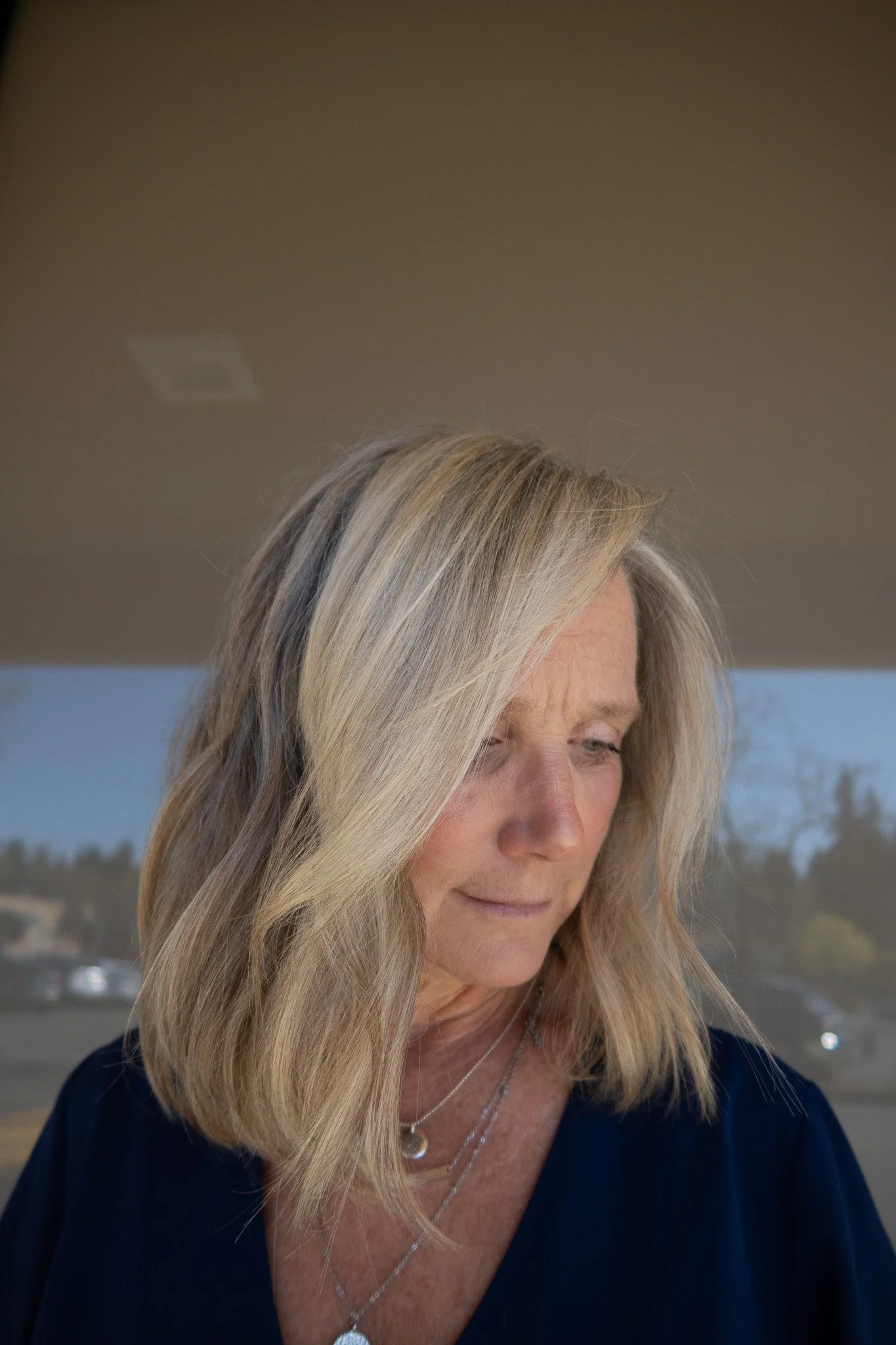 Low-maintenance grey blending with seamless dimension and a soft, modern bob haircut by Bothell hairstylist Chloe Webster at Salon Janae