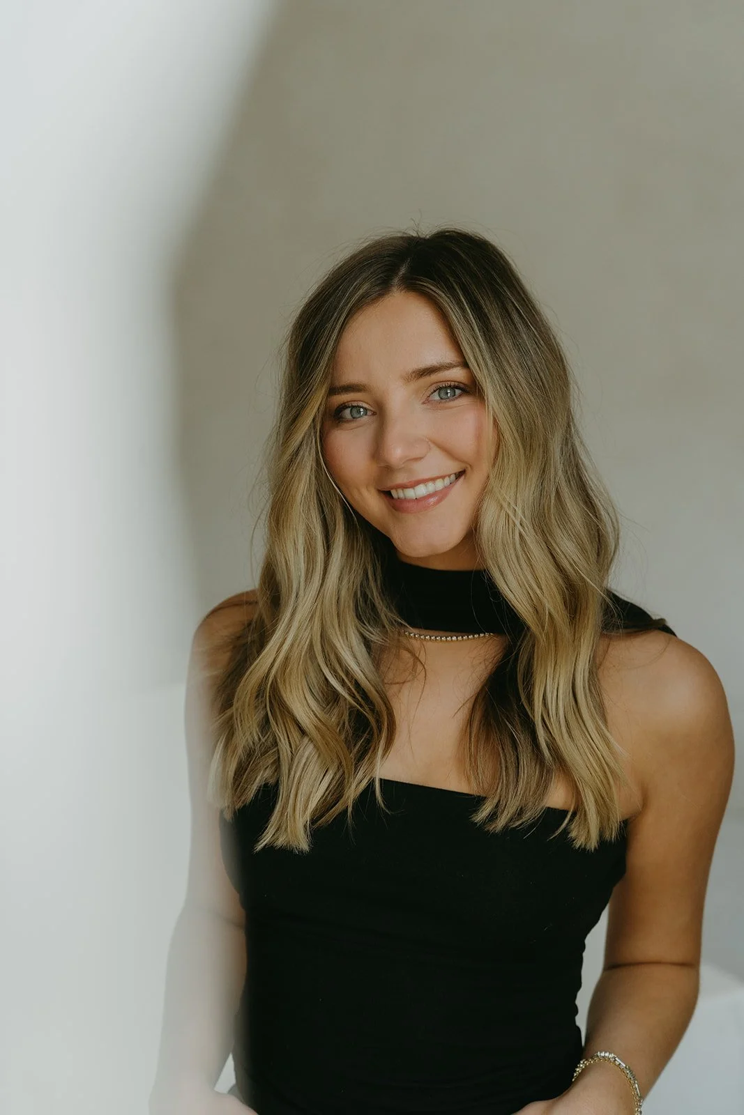 Chloe Webster, owner of Salon Janae and hairstylist specializing in lived-in blondes, brondes, and grey blending