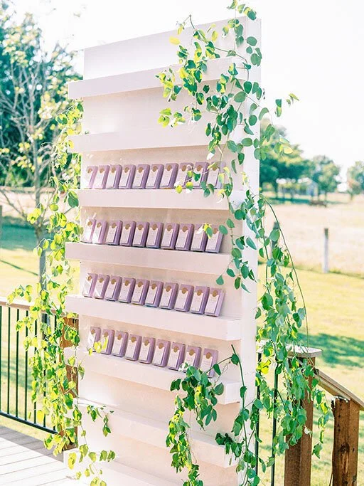 White seating chart with floating shelves