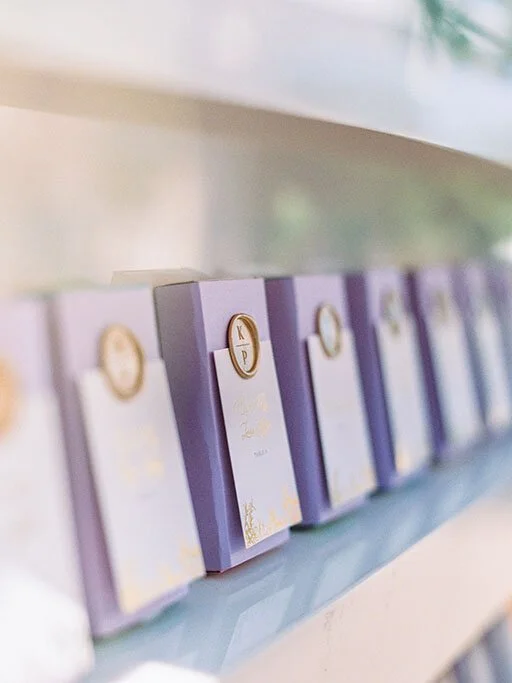 Purple wrapped escort cards with wax seals