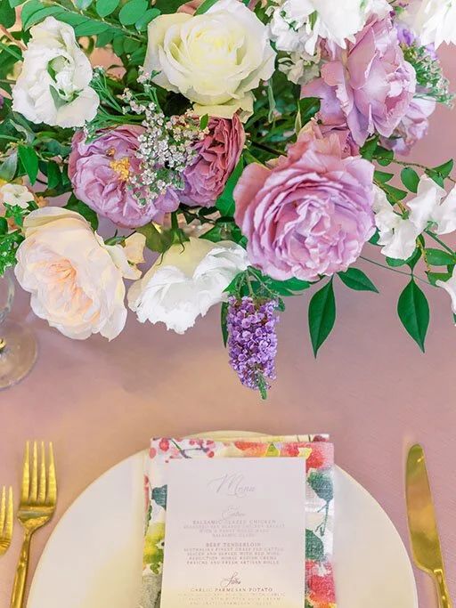 pink and purple flowers over a floral napkin