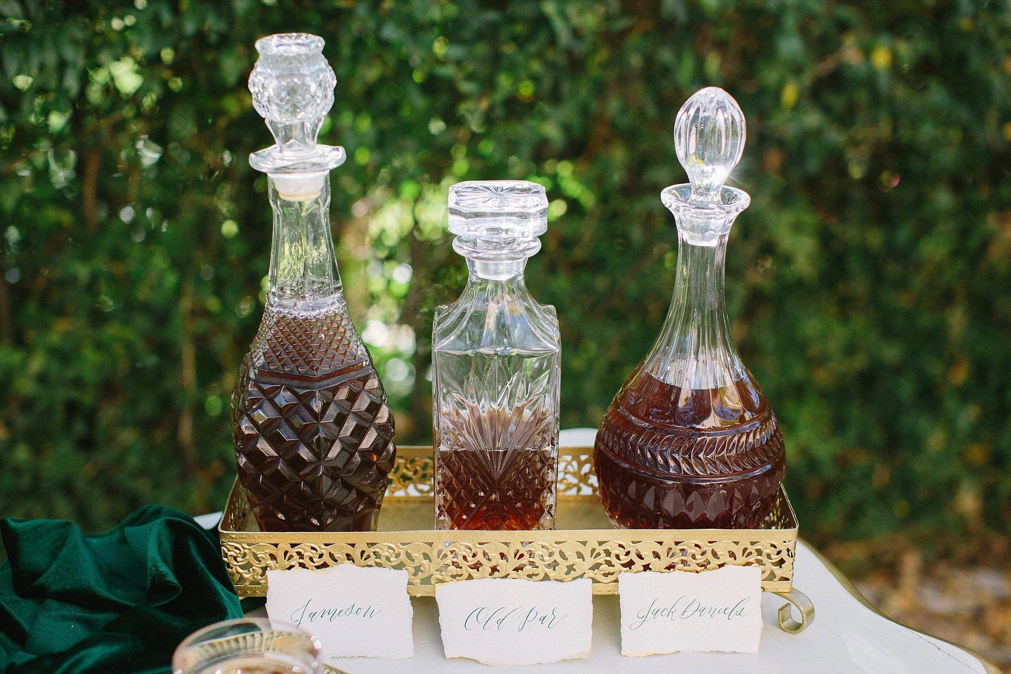 aristide mansfield wedding whiskey bar with antique decanters