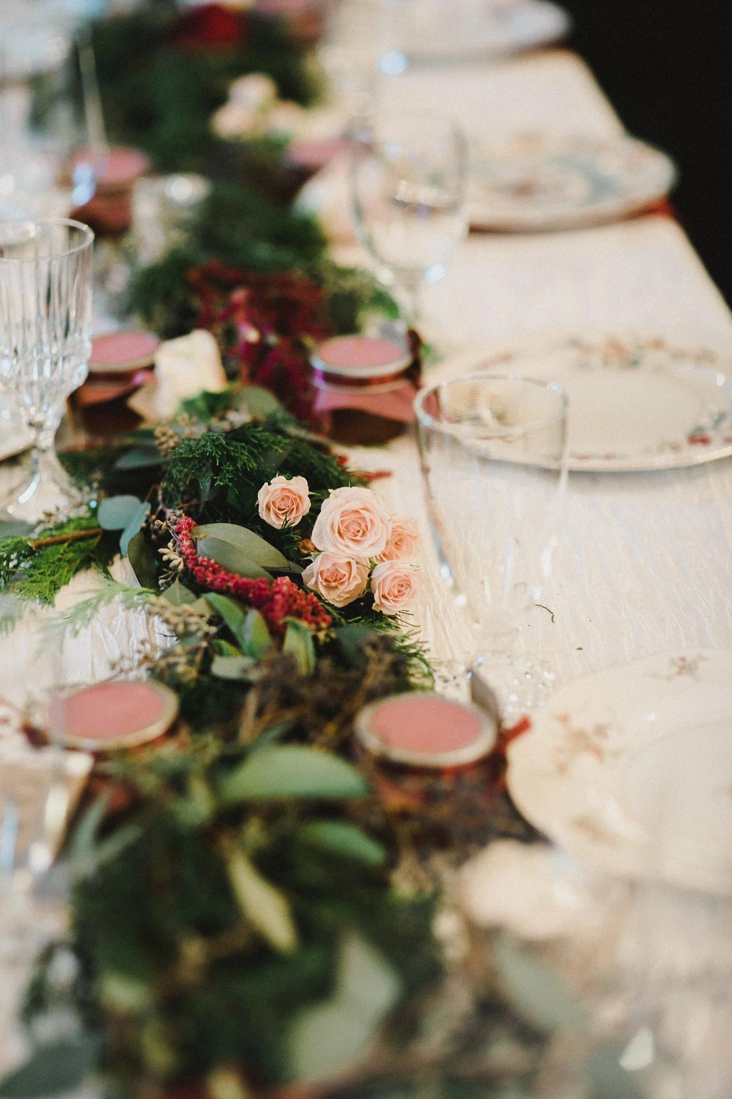 Hollow Hill Farm Event Center Wedding table garland with evergreen greenery and blush and cream rose