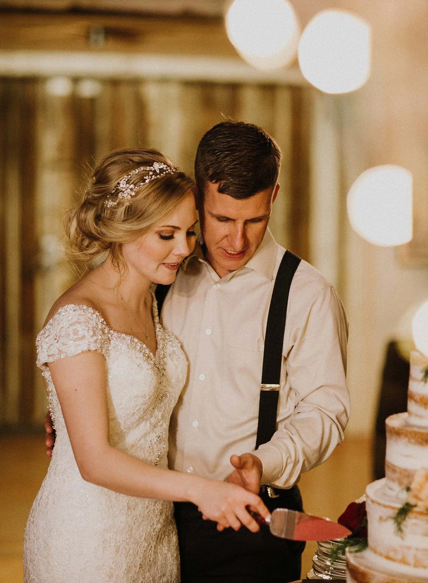 Hollow Hill Farm Event Center Wedding bride and groom cutting cake in old town
