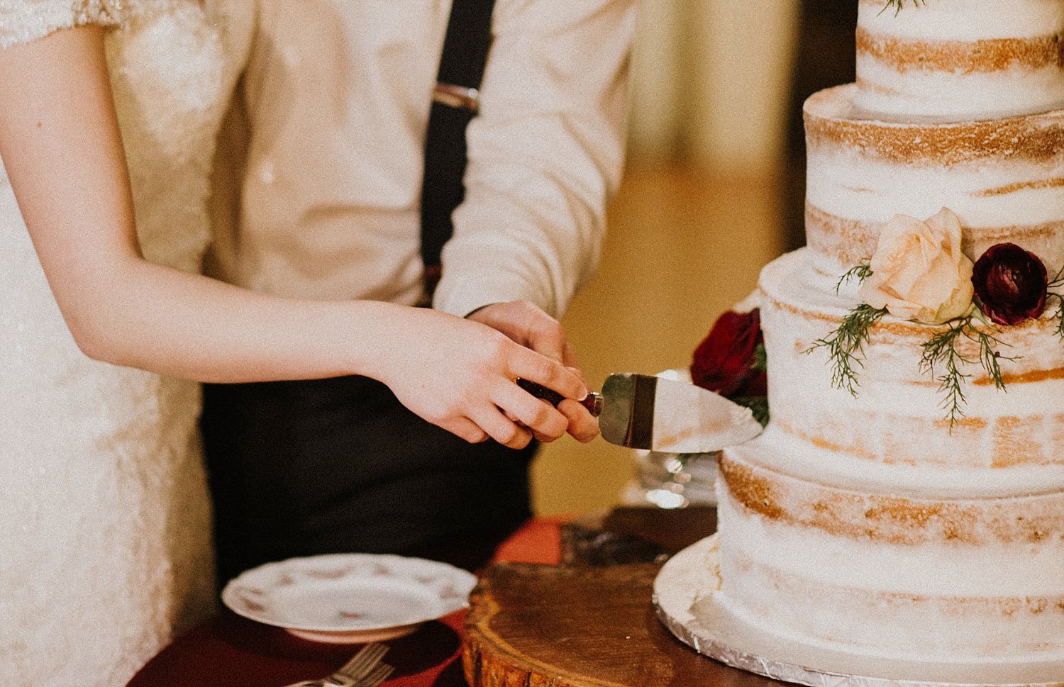Hollow Hill Farm Event Center Wedding bride and groom cutting cake in old town