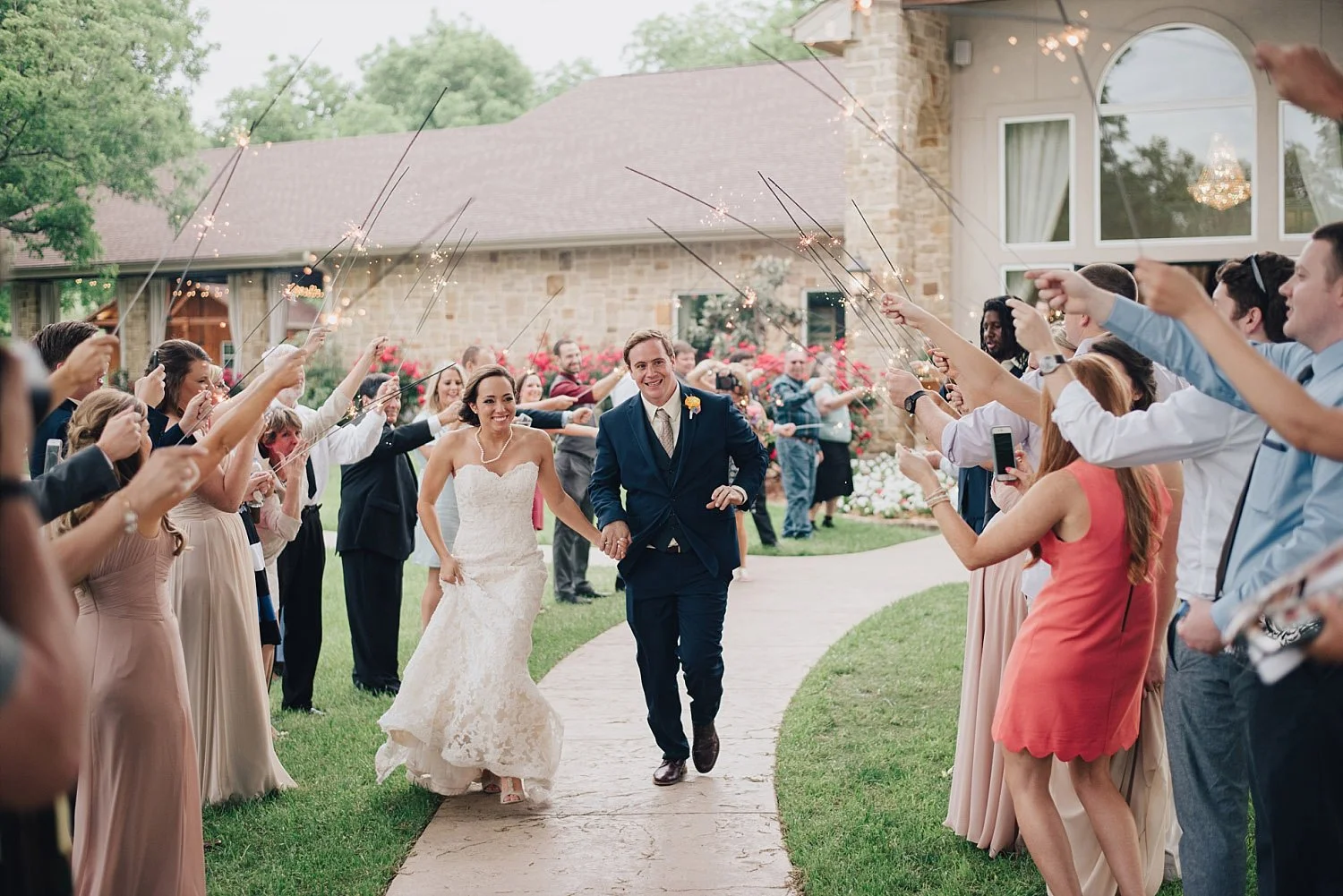 The Orchard Azle wedding sparkler exit during the day