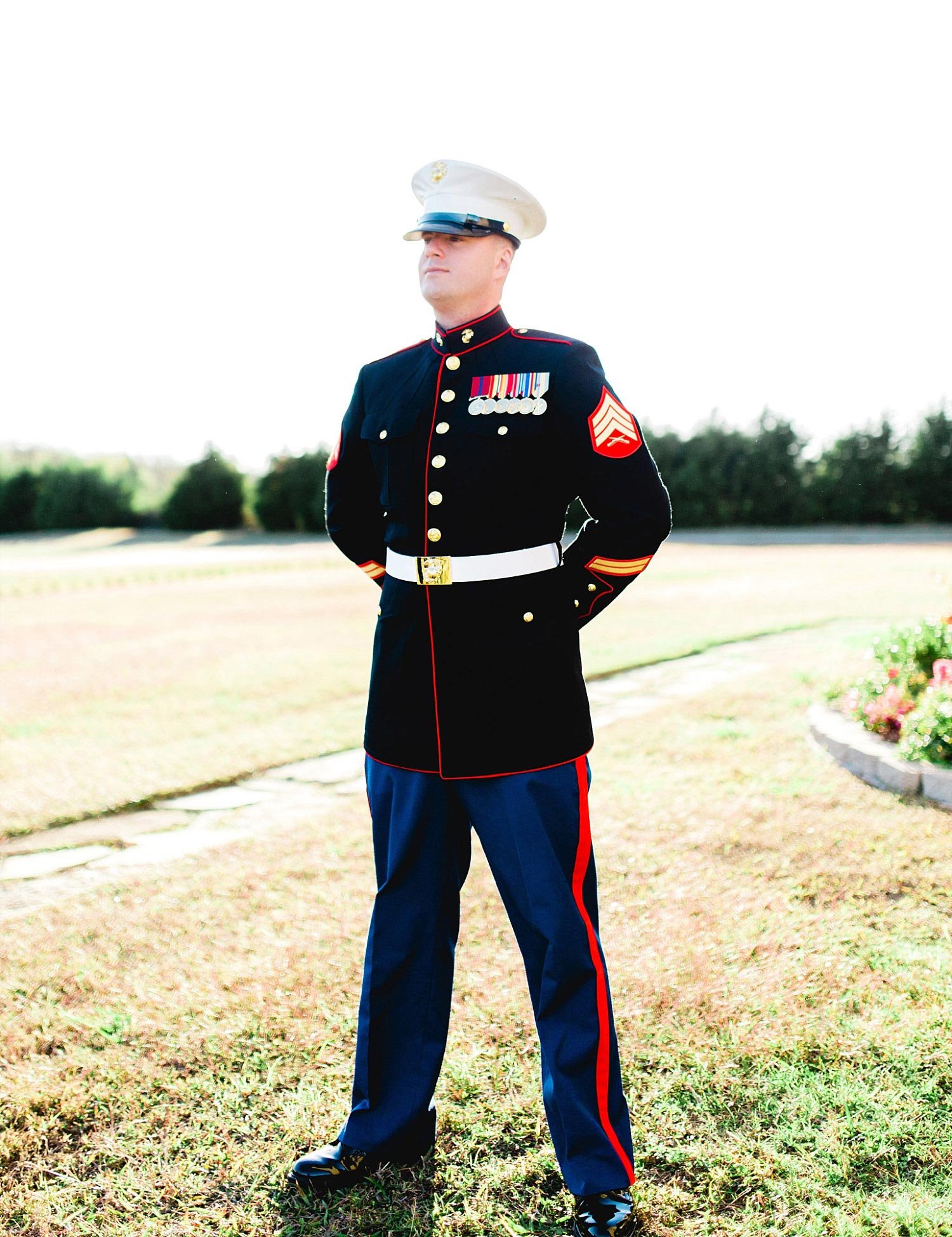 Castle at Rockwall wedding groom in marine uniform outside photo