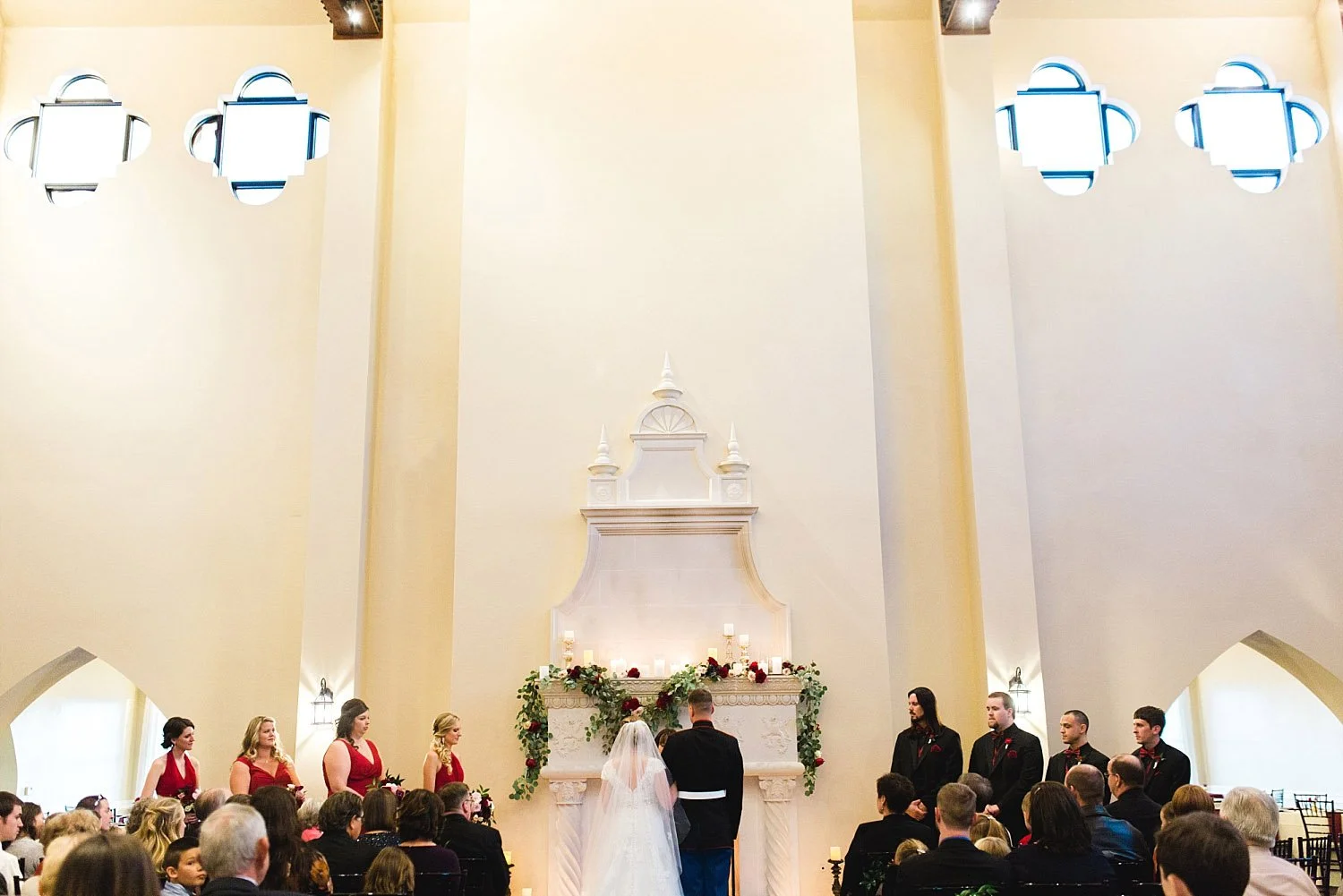 Castle at Rockwall wedding ceremony in front of fireplace