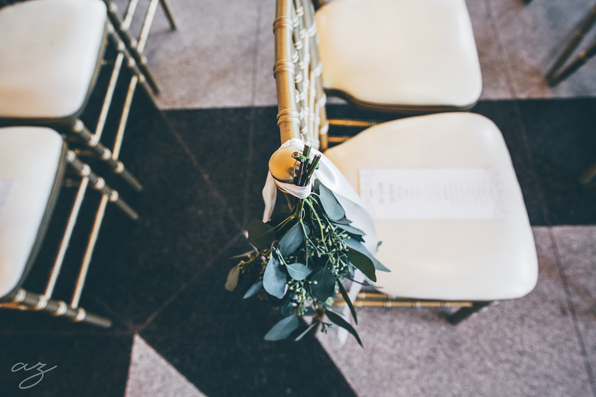 Carlisle Room wedding greenery on chivari chair
