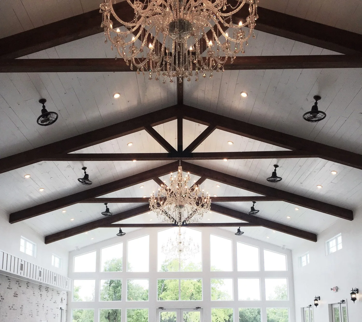 Firefly gardens event hall tall windows and wood beams