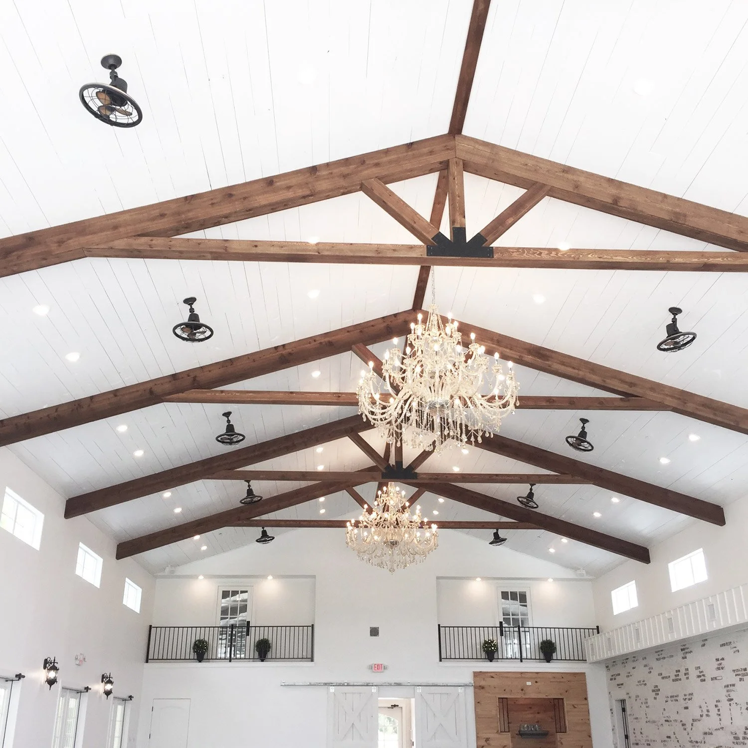 Firefly Gardens white barn with bar and balconies