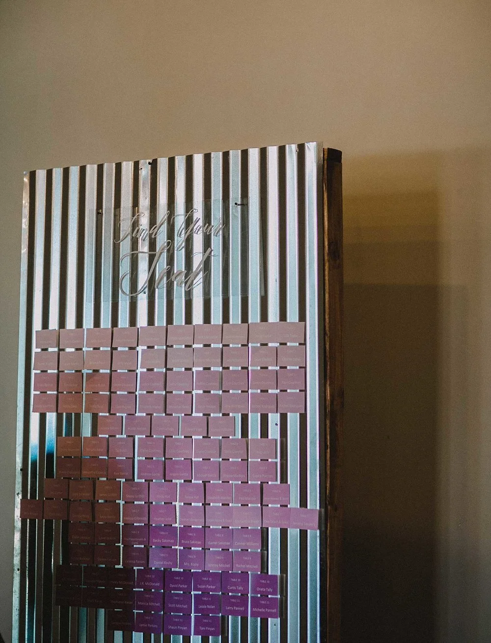 Galvanized metal seating chart with ombre escort cards and acrylic sign