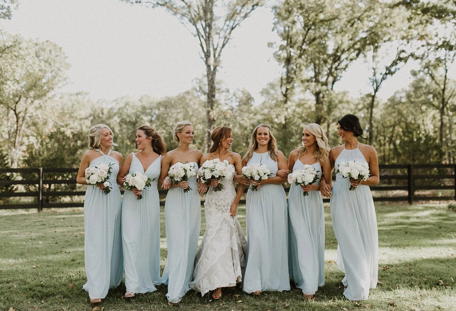 These dusty blue bridesmaid dresses were perfect for this rustic wedding! They matched perfectly with the white and blush bridesmaid bouquets