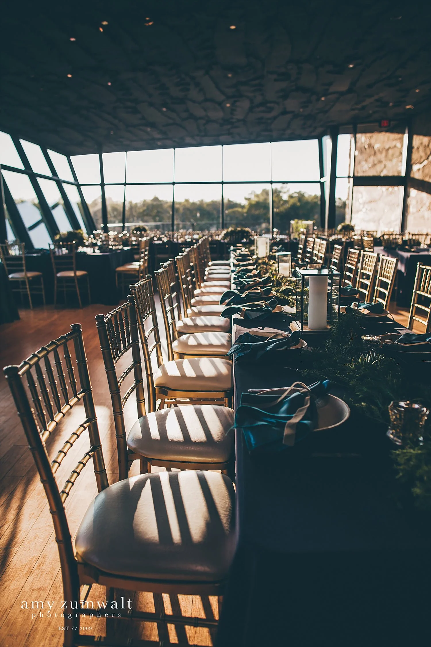 Gold chivari chairs by a window
