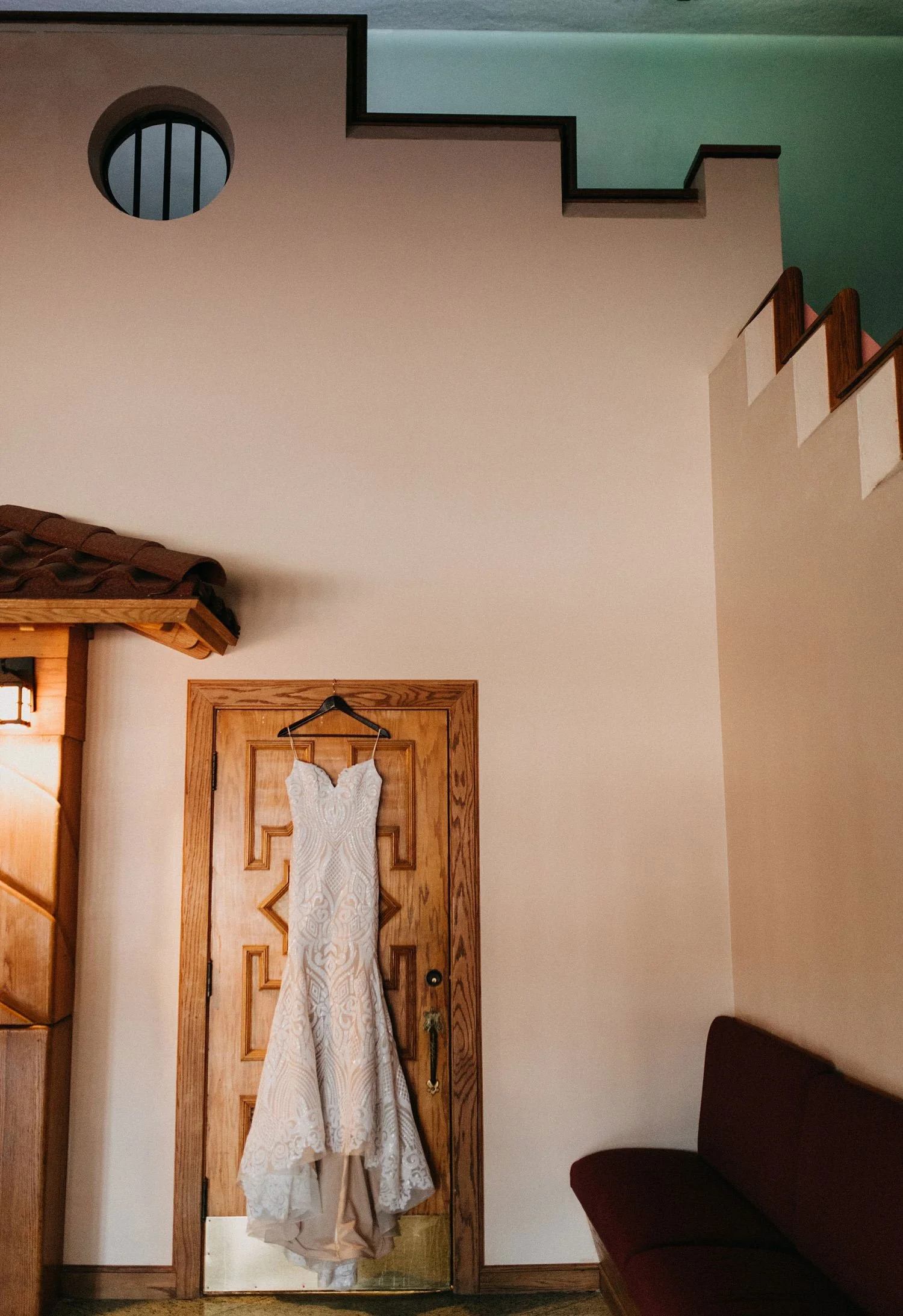 Dress hanging on a pink wall