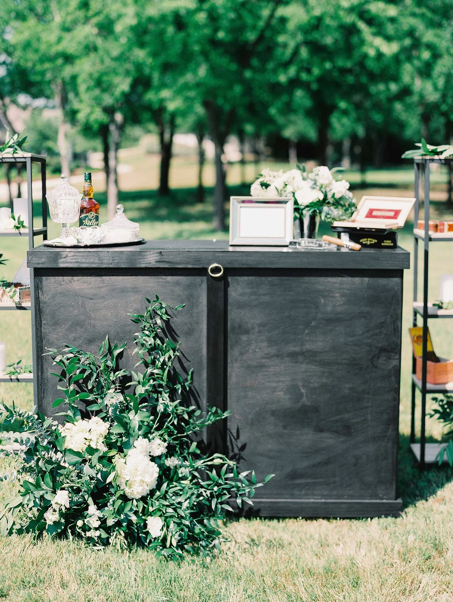 Cigar bar with a black bar and wood shelves