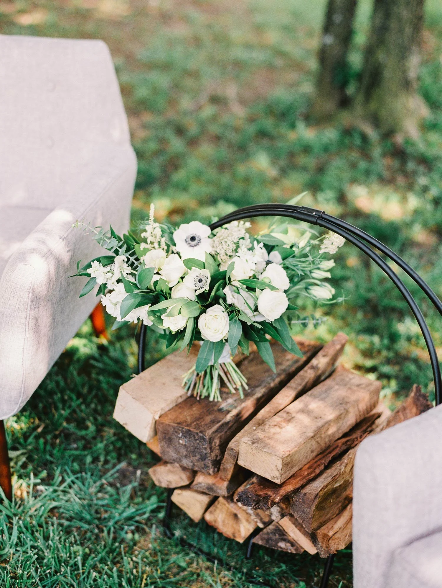 White flowers on a round firewood hearth hoop