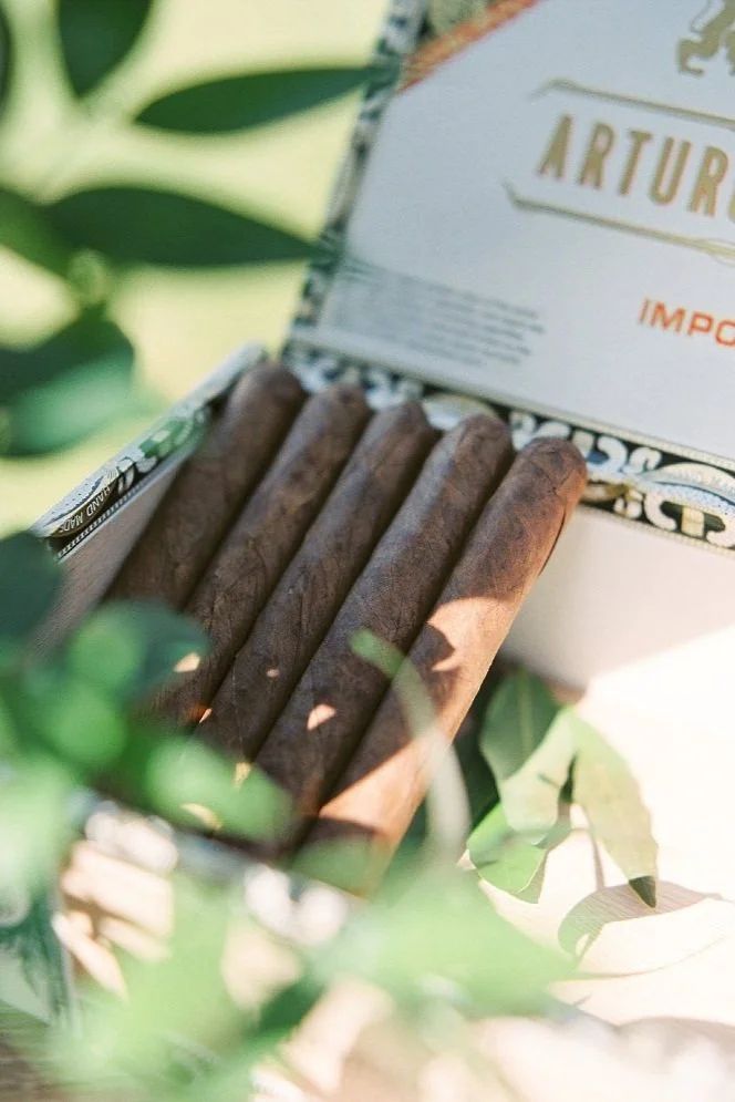 Cigar boxes and candles on shelves for a cigar bar for a classic wedding