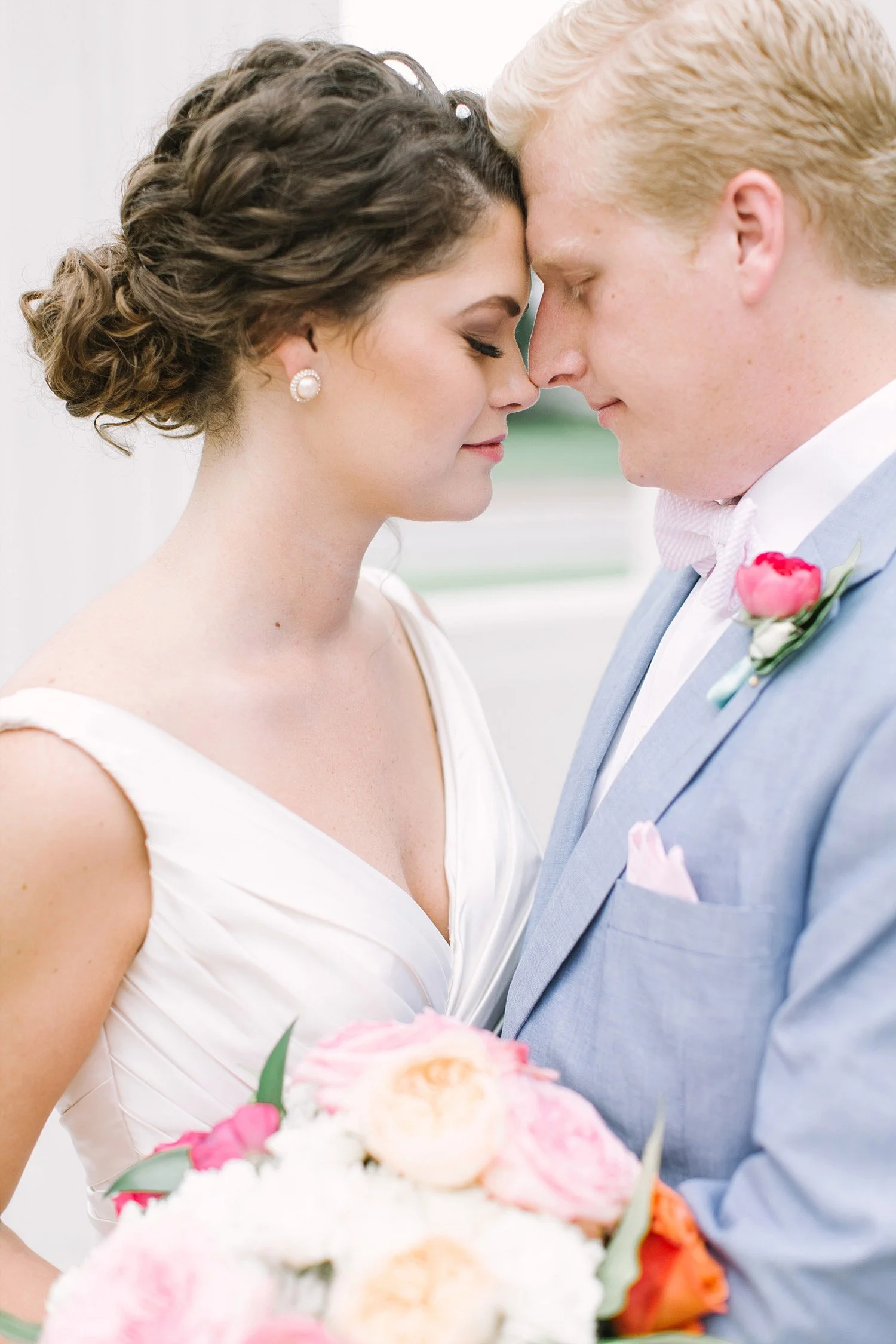 Bride and groom kissing at Old Red Museum