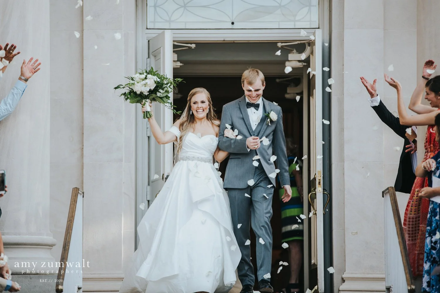 Bride and groom pedal exit at churc