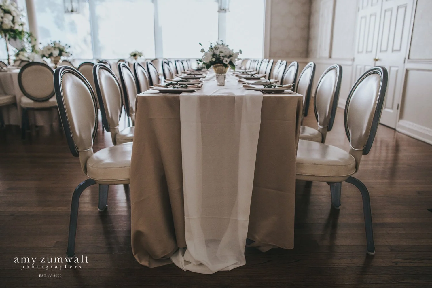 Chiffon white runner on champagne linen